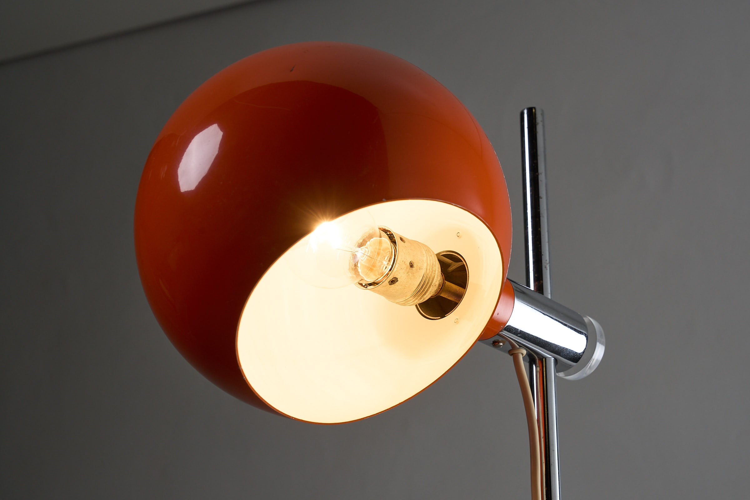 Orange Sphere Floor Lamp with Diffuser featuring a bright orange sphere shade and chromed steel stem.