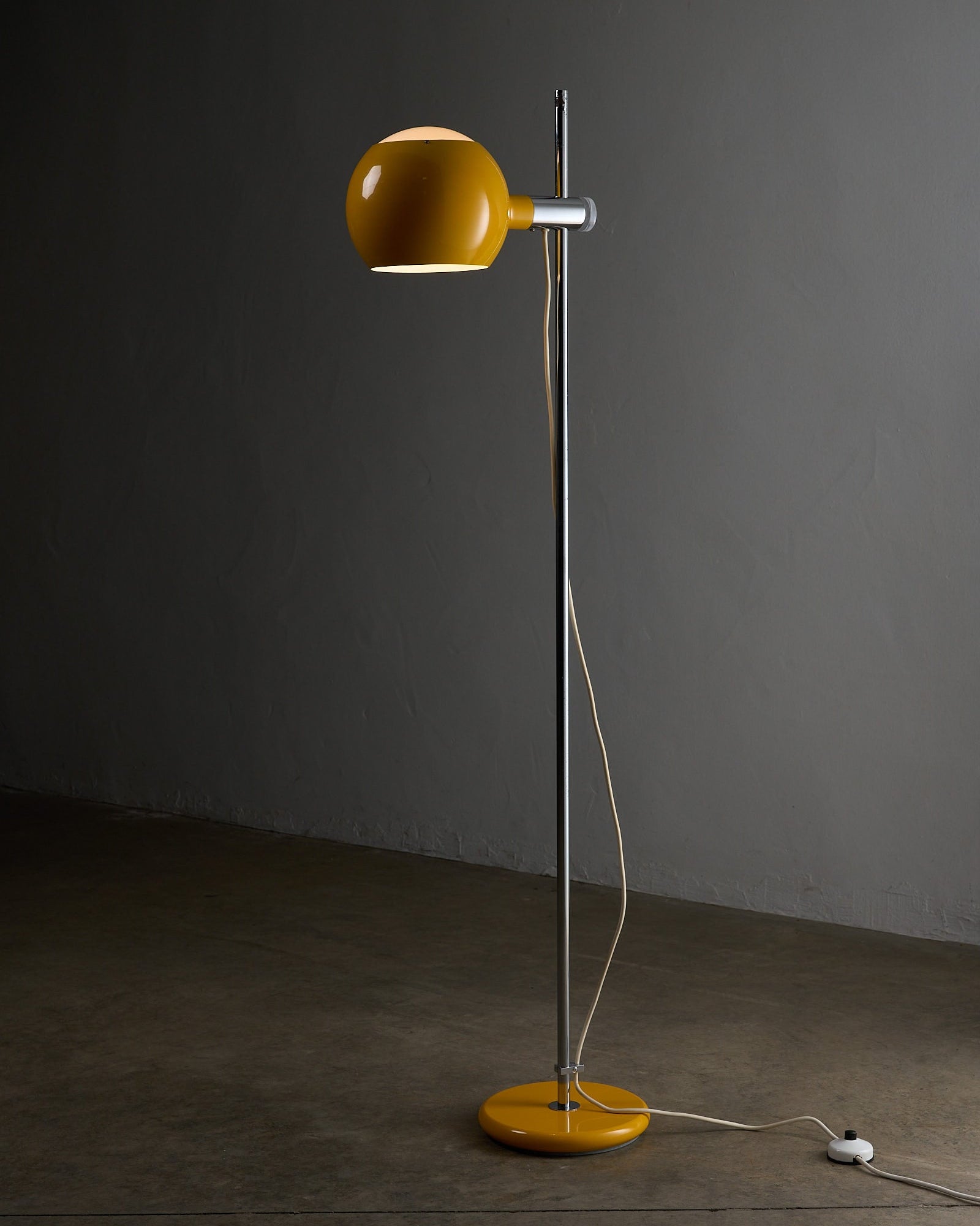 Yellow Sphere Floor Lamp with Diffuser featuring a yellow lacquered metal sphere and chromed steel stem.
