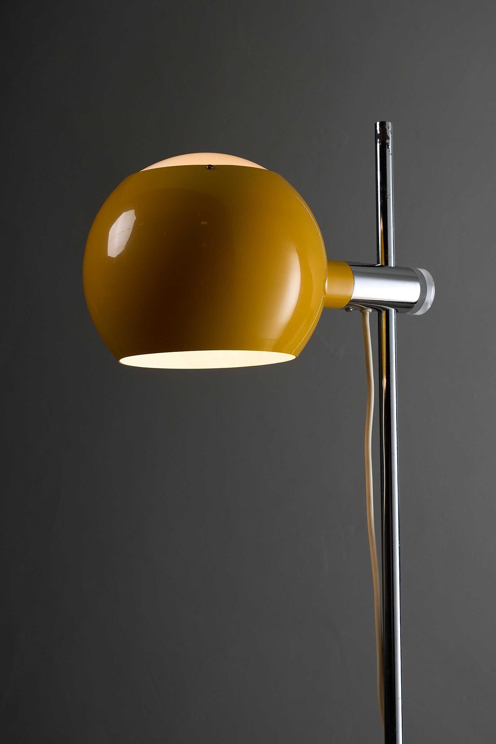 Yellow Sphere Floor Lamp with Diffuser in a sleek design, featuring a rotatable yellow shade and chromed steel stem.