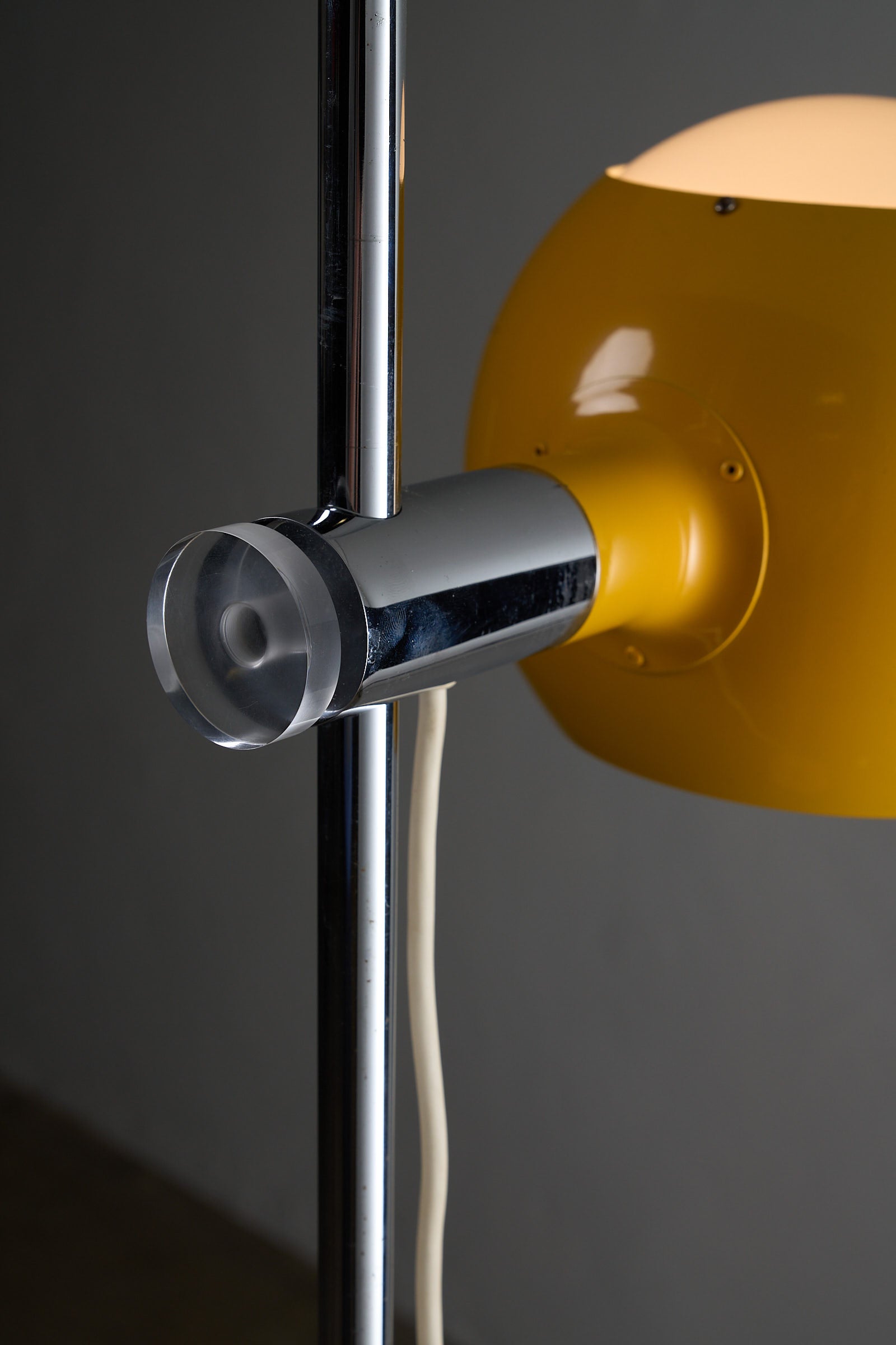 Close-up of the Yellow Sphere Floor Lamp with Diffuser showcasing chrome details and yellow shade.