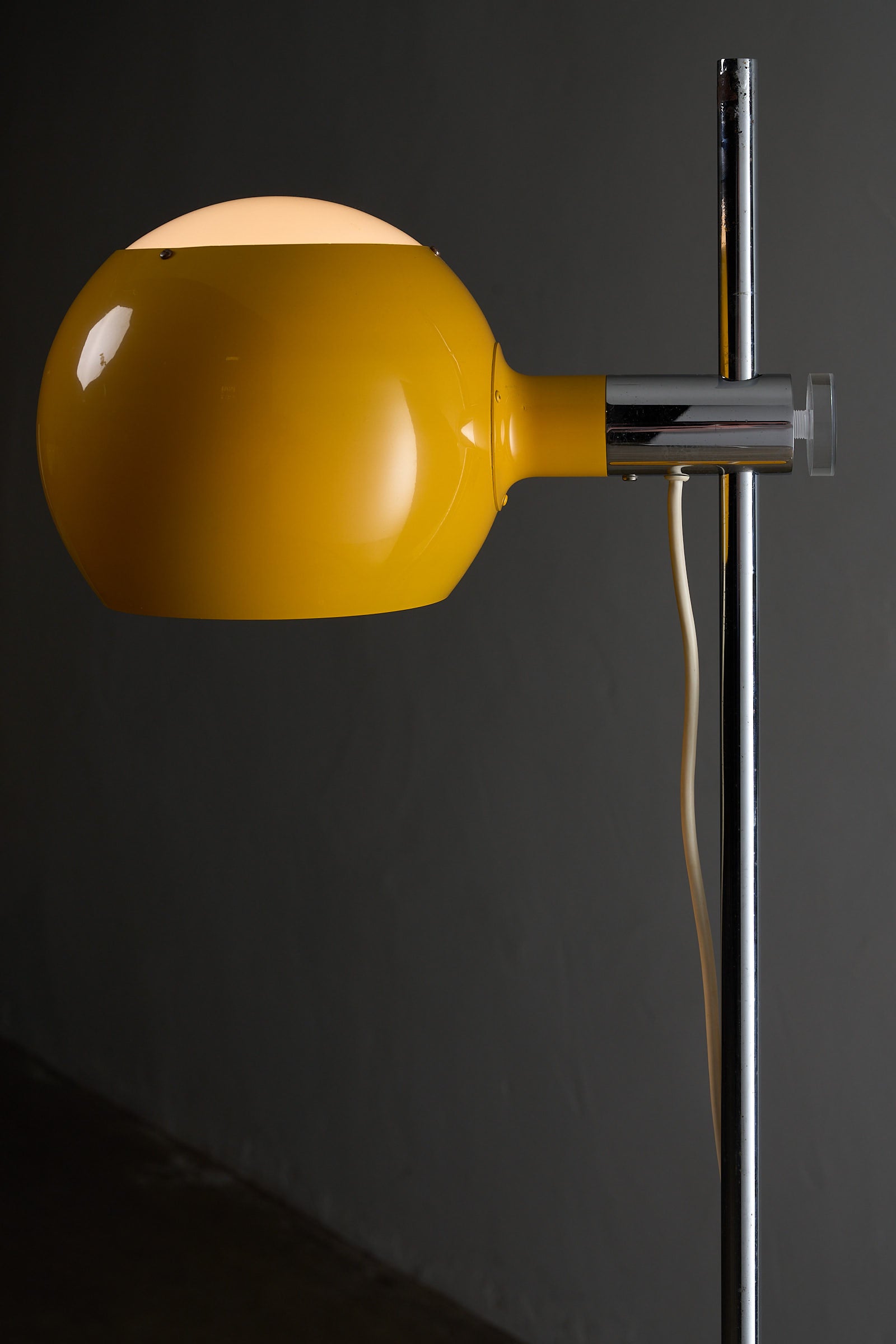 Yellow Sphere Floor Lamp with Diffuser featuring a yellow metal shade and chrome stem.