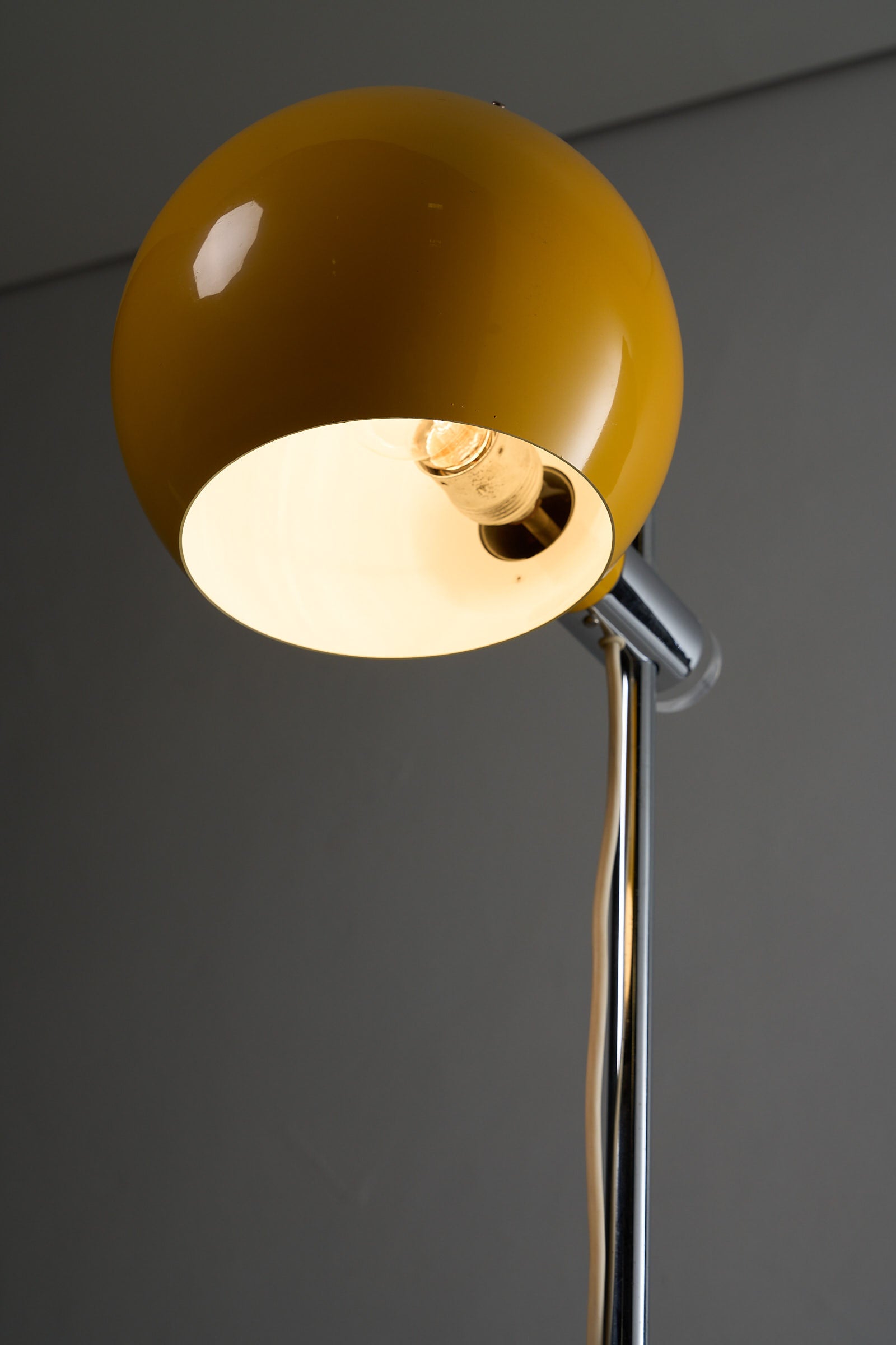 Yellow Sphere Floor Lamp with Diffuser featuring glossy yellow shade and chrome stem.