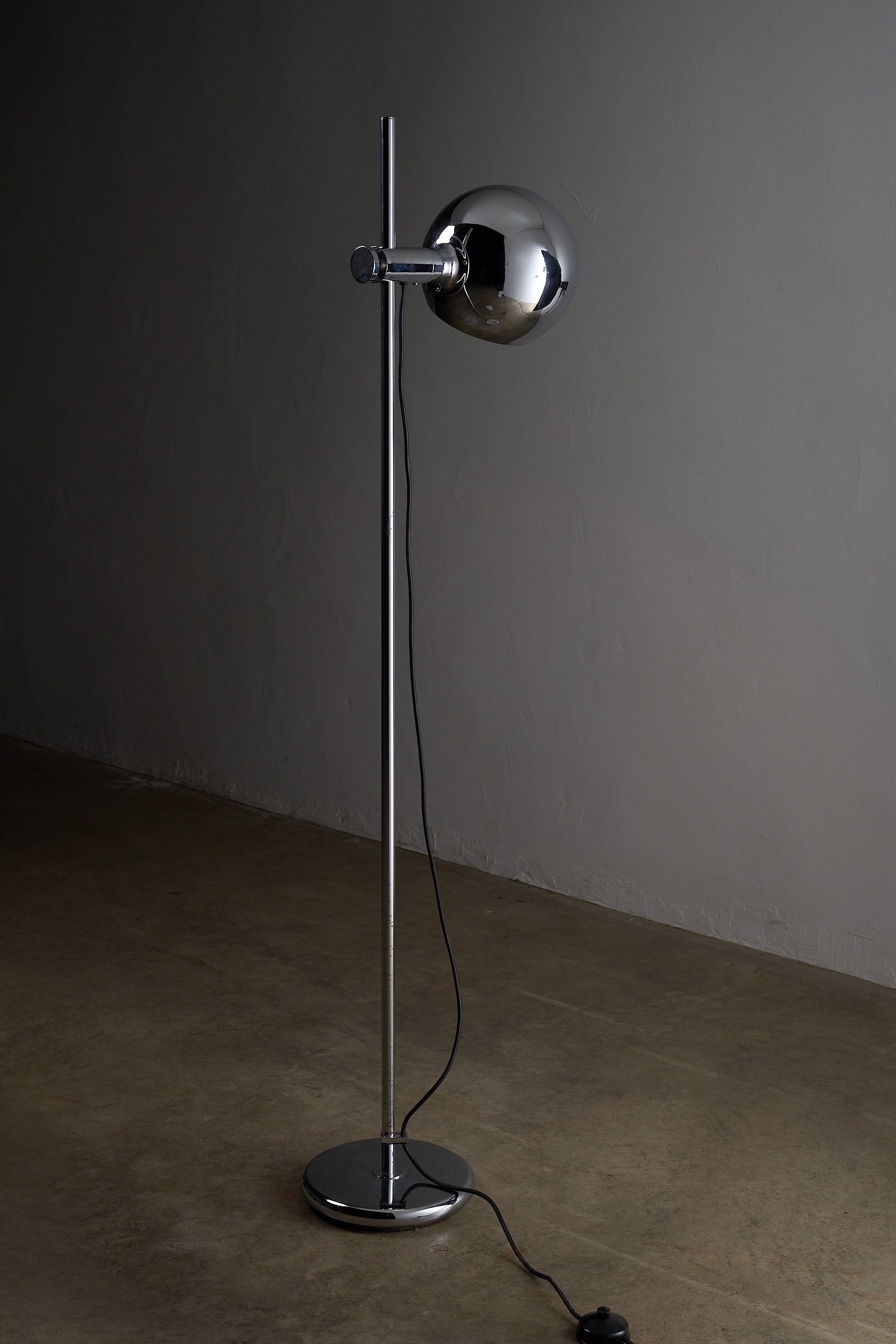 Chrome Sphere Floor Lamp in polished chrome with adjustable shade and sleek design.