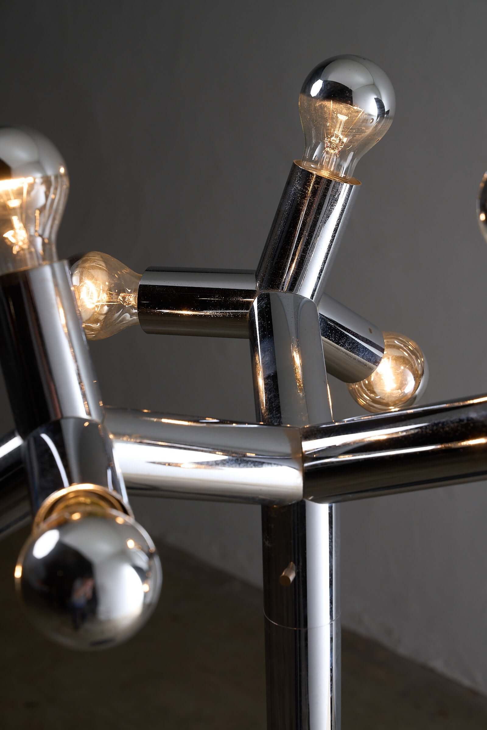 Space Age Atomic Floor Lamp featuring geometric chrome design with bulbs illuminated.