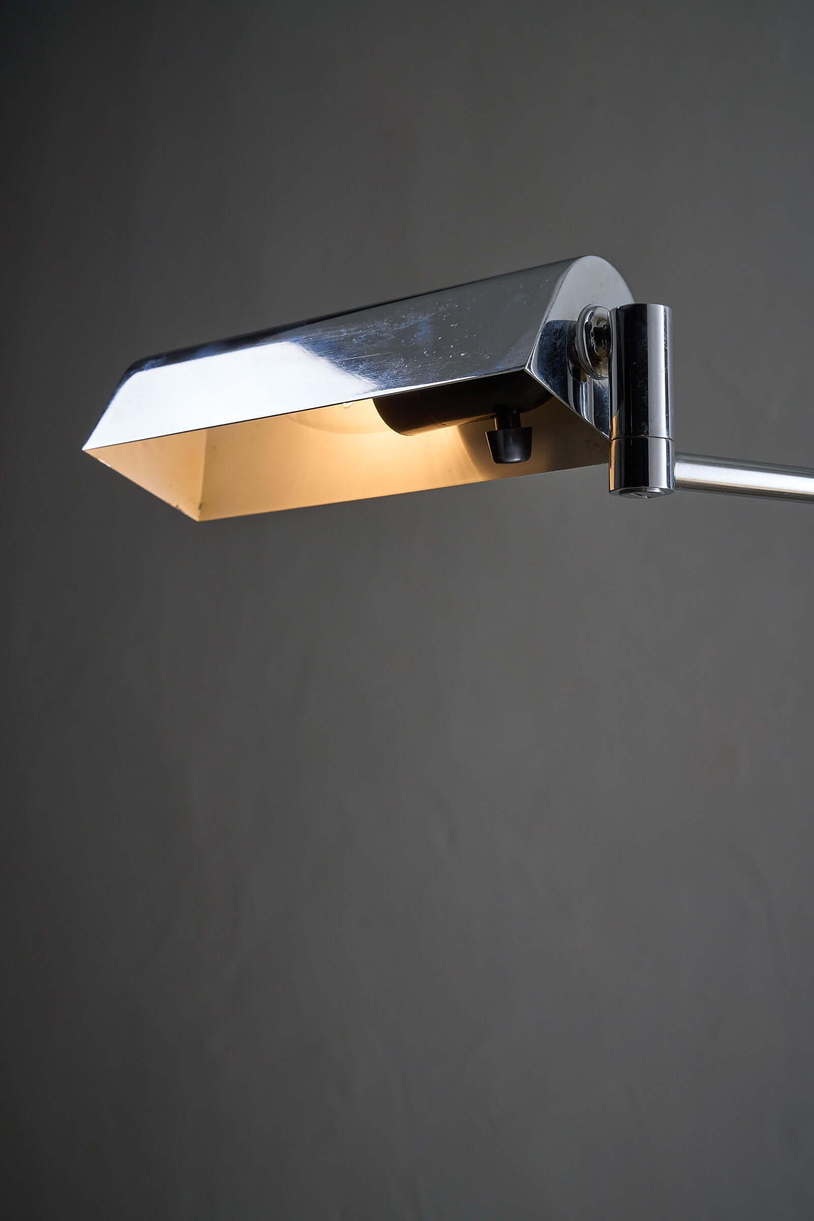 Close-up of George Hanson Floor Lamp with adjustable chrome shade and light.