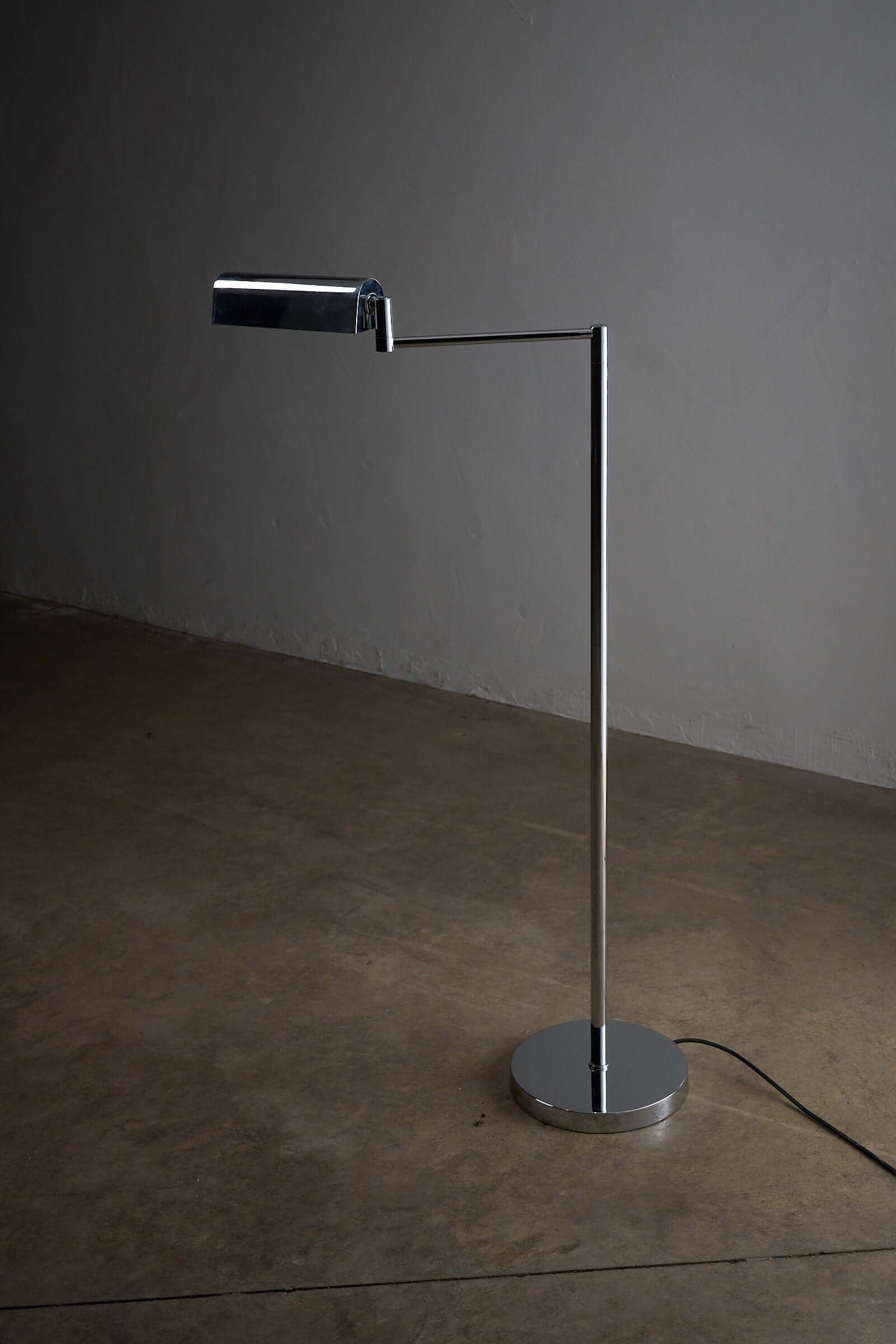 George Hanson Floor Lamp in polished chrome with adjustable swing-arm design.