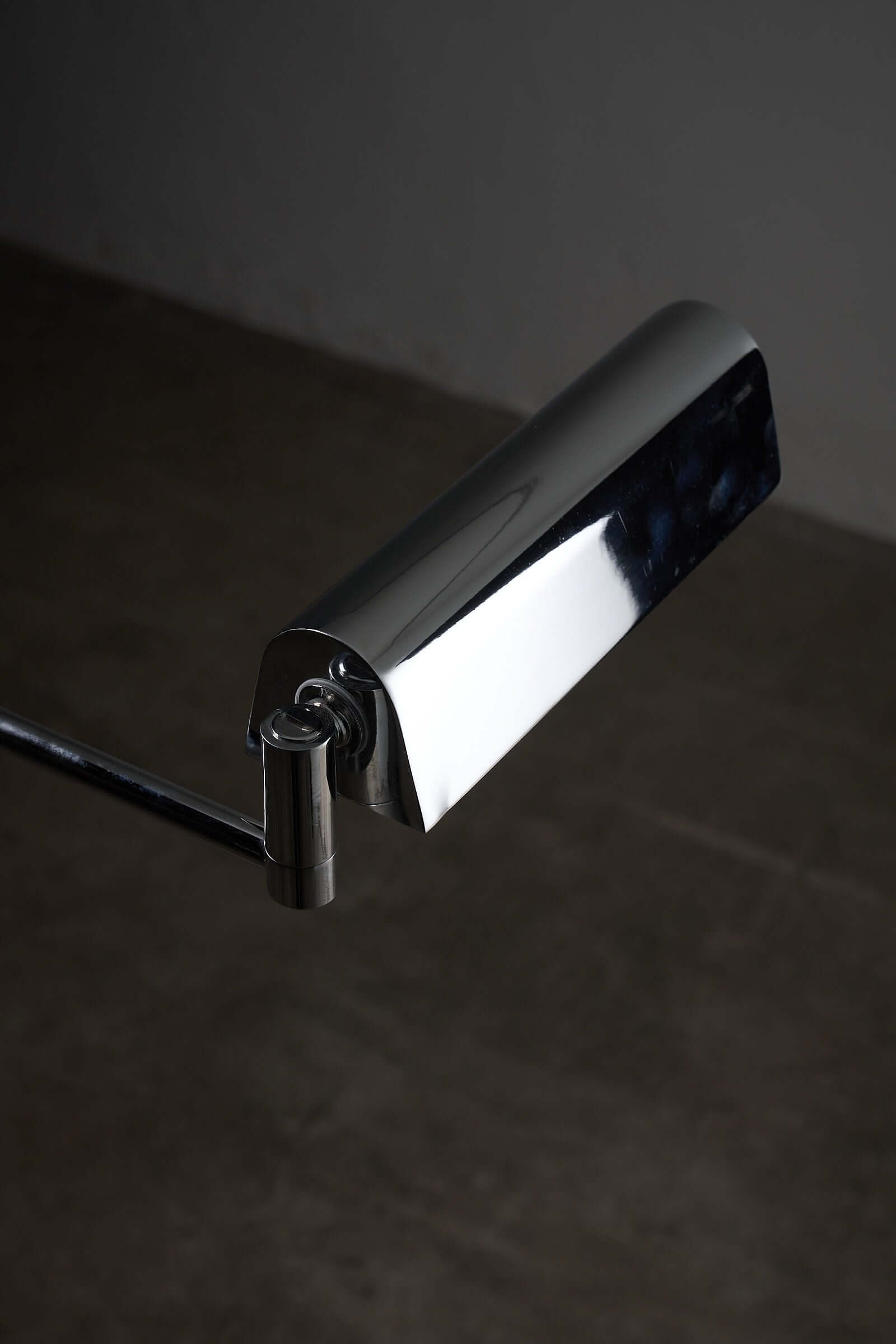 Close-up of George Hanson Floor Lamp's polished chrome swing-arm with adjustable mechanism.