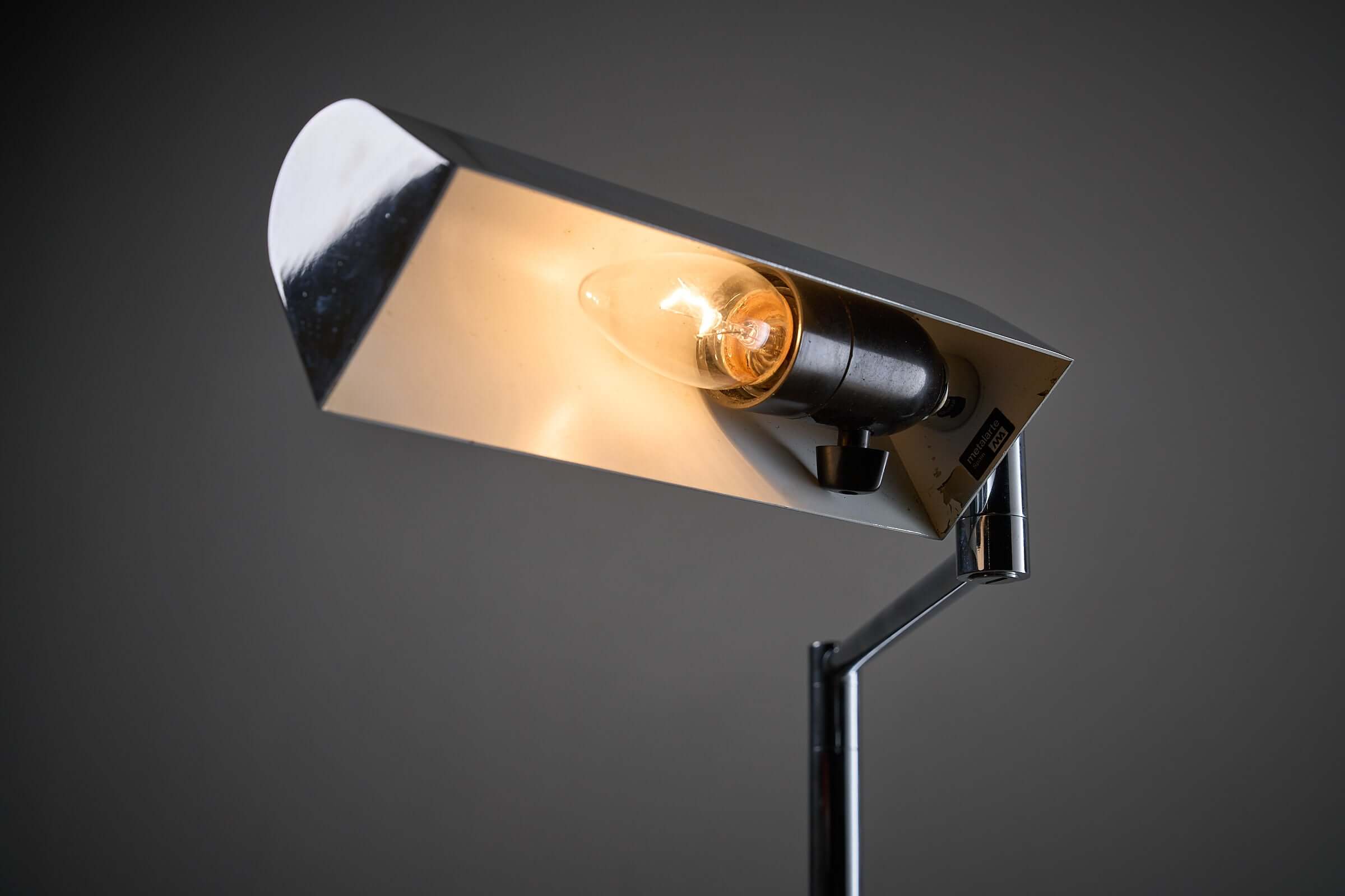 George Hanson Floor Lamp with polished chrome finish and adjustable swing arm, showcasing minimalist design.