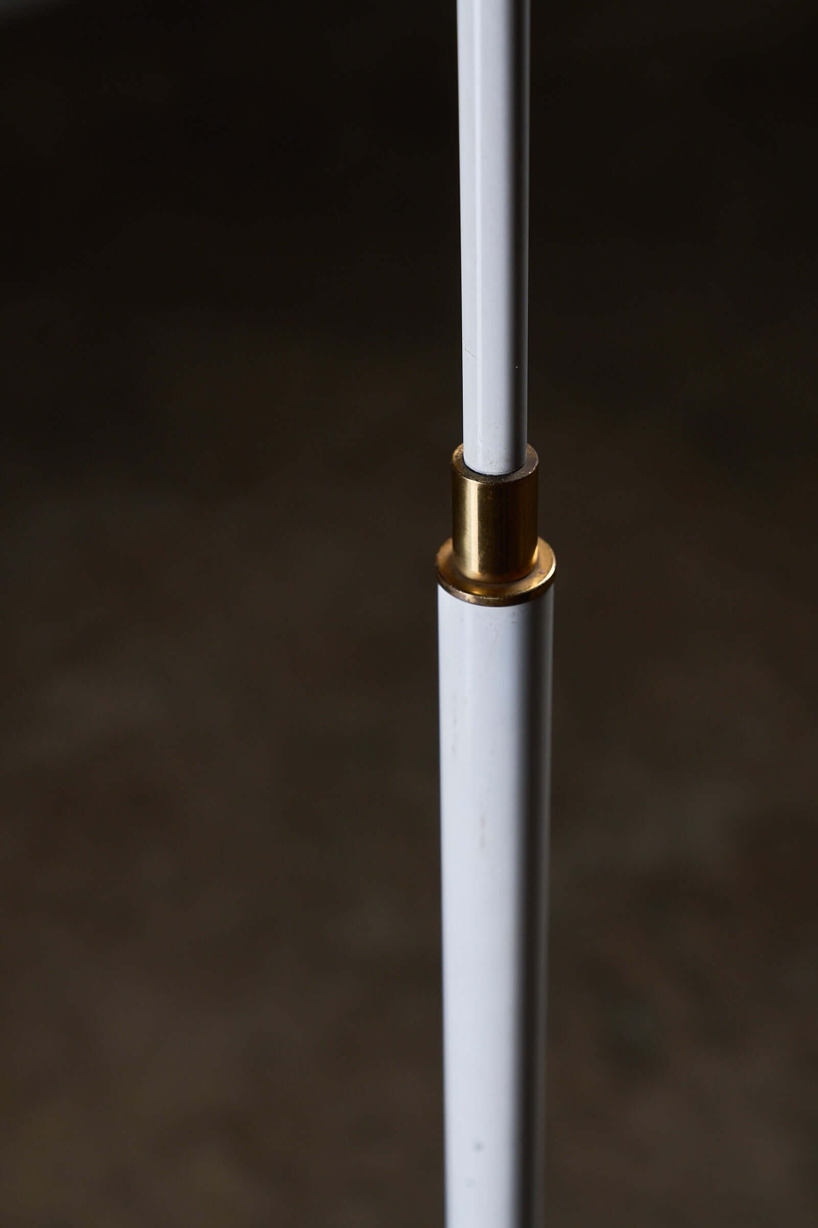 Close-up of Adjustable Floor Lamp by Boulanger, White Finish, showcasing brass details and sleek white design.