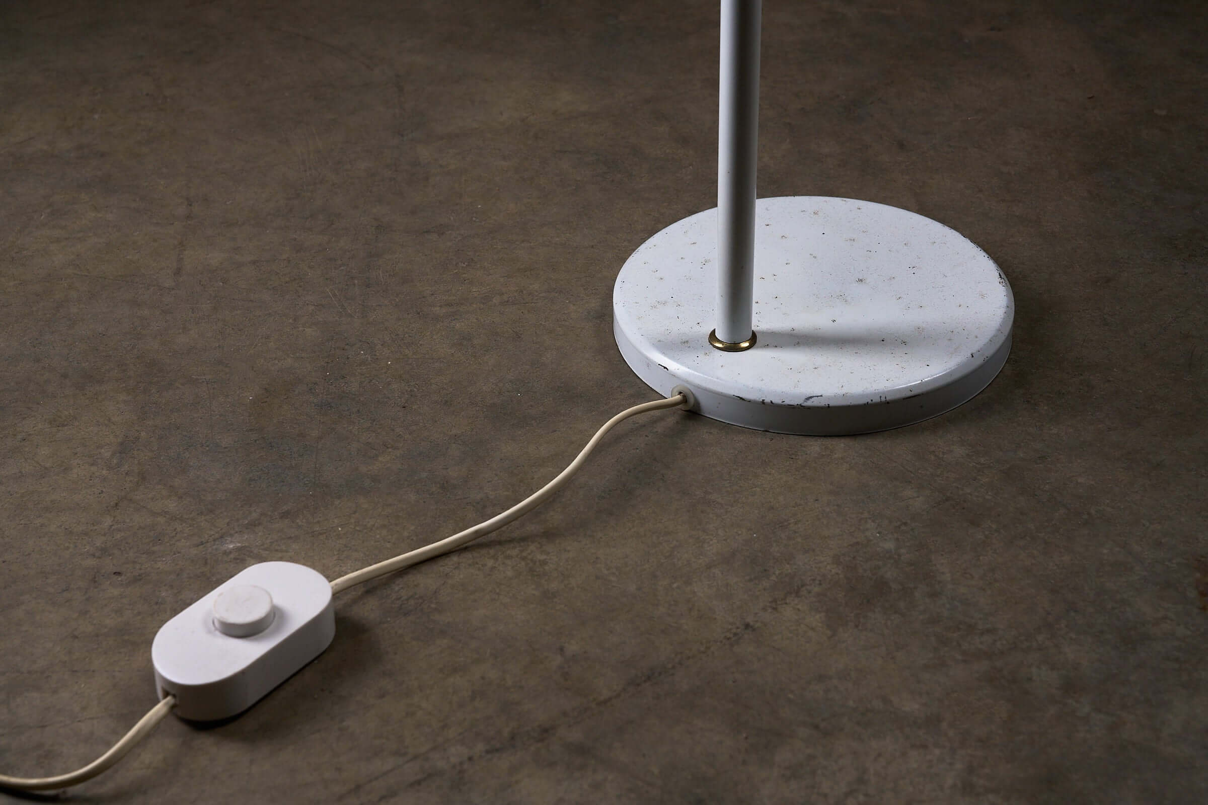 Adjustable Floor Lamp by Boulanger, White Finish base with switch and cord, showcasing minimalist design elements.