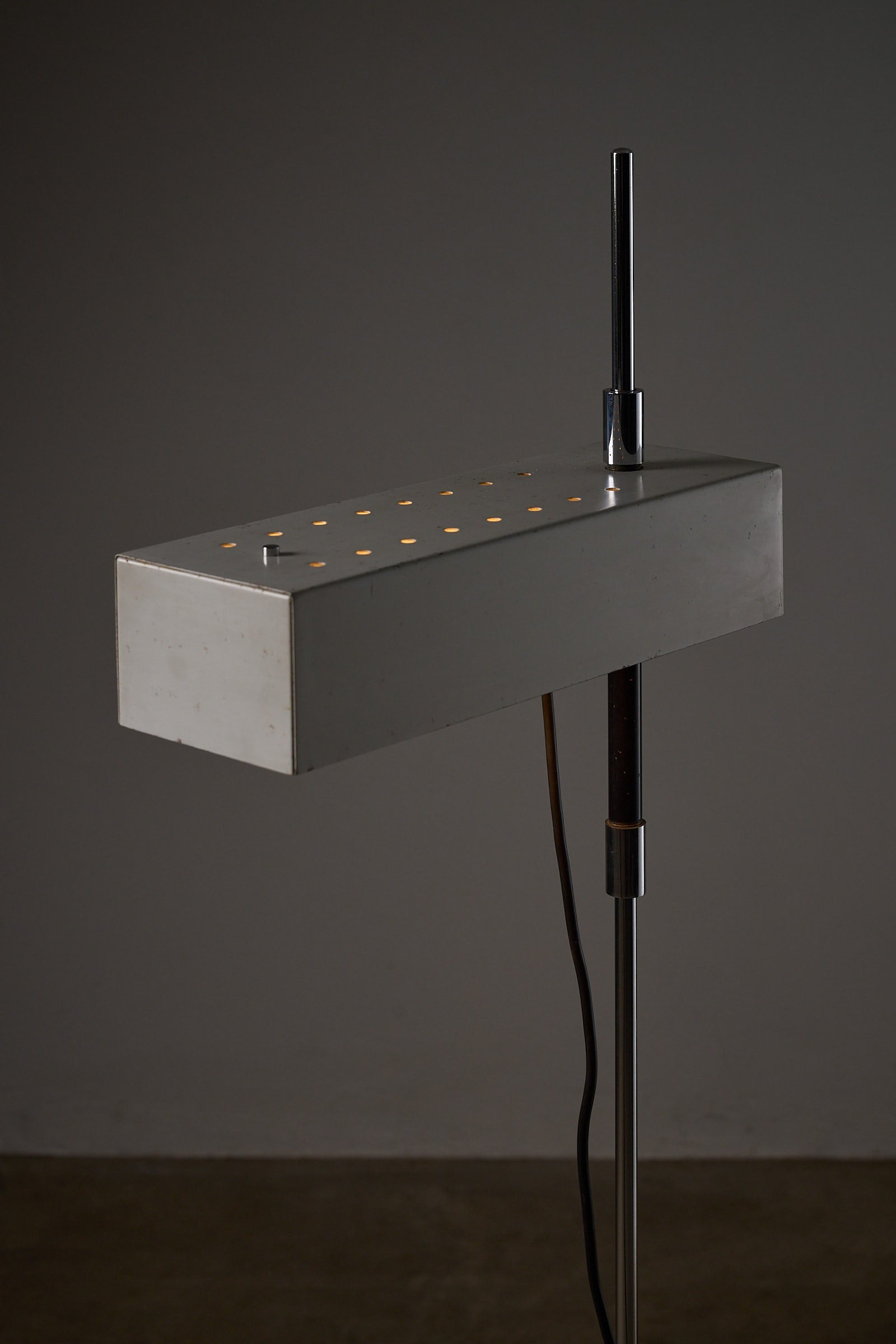 Adjustable Perforated Shade Floor Lamp with metal finish and perforated design highlights, perfect for modern decor.