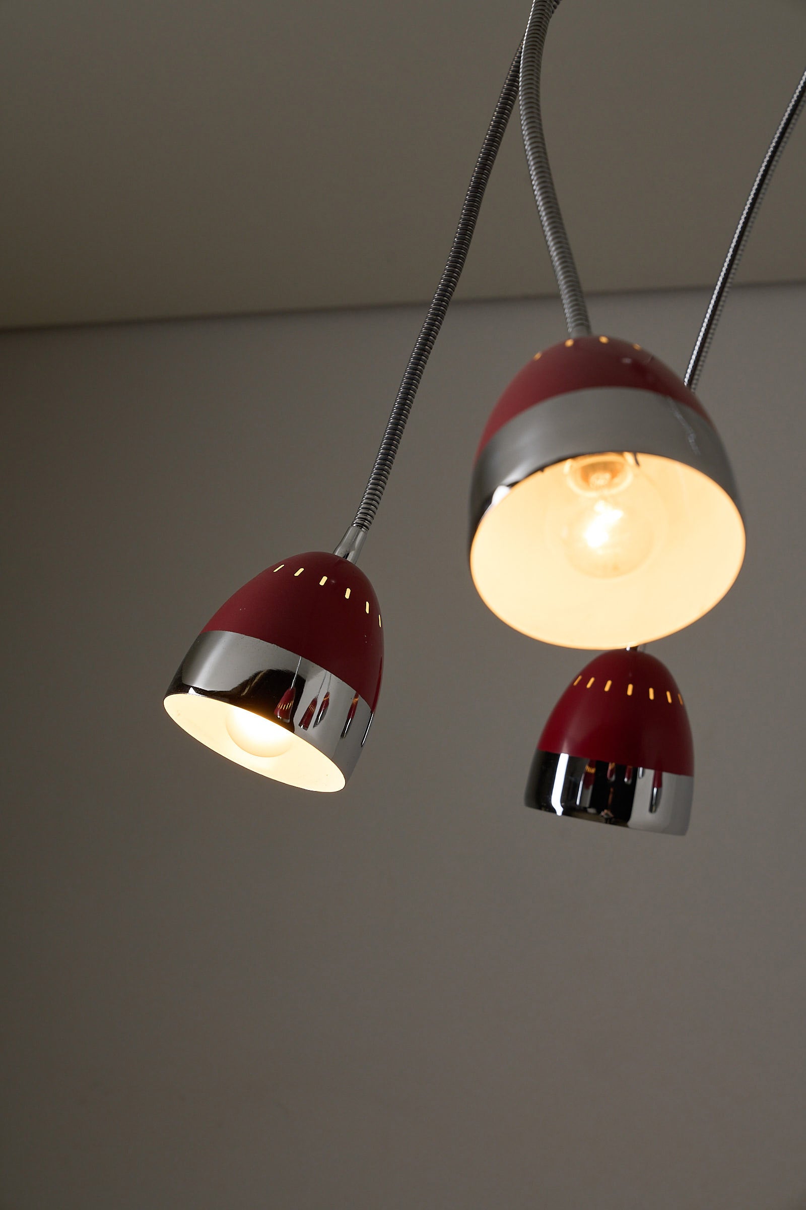 Six-Arm Flexible Ceiling Lamp, Chrome & Bordeaux with red enamel shades and chrome details, showcasing modern design.