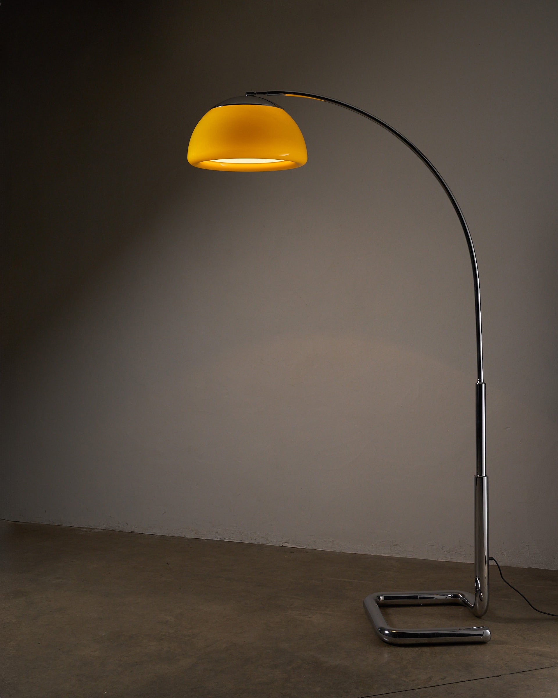 Arc Floor Lamp Acrylic Shade, Cosack (c. 1970s) with yellow shade and chrome base in a modern setting.