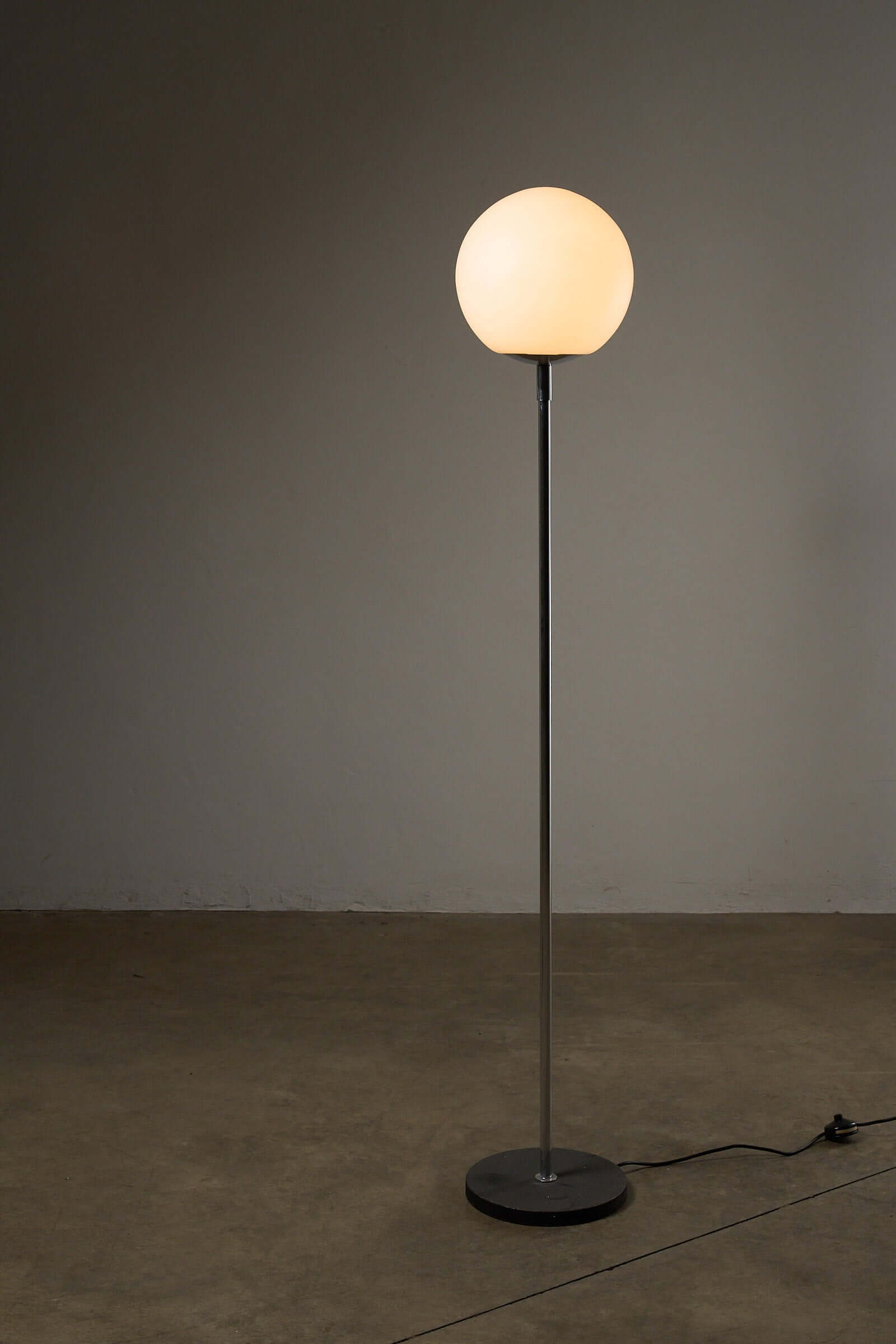 Opal Glass Dome Floor Lamp with Chrome Stem (c. 1970s) featuring a minimalist design and geometric forms.