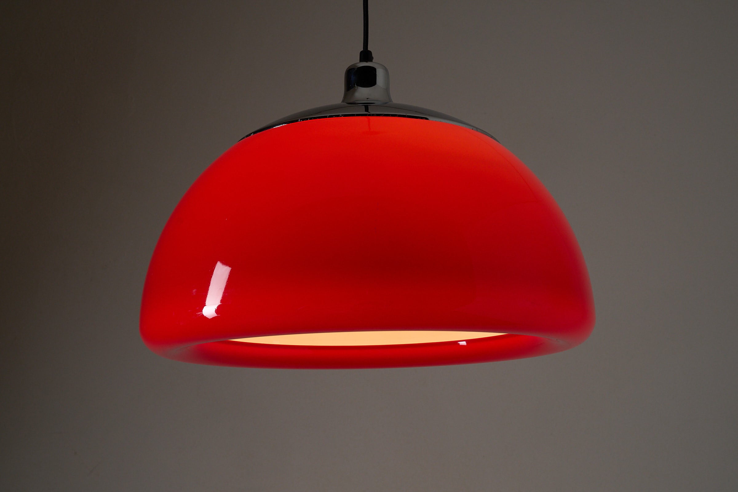 Cosack red acrylic ceiling lamp with chrome detail, Germany, 1970s, vibrant Space Age pendant with bold red shade.