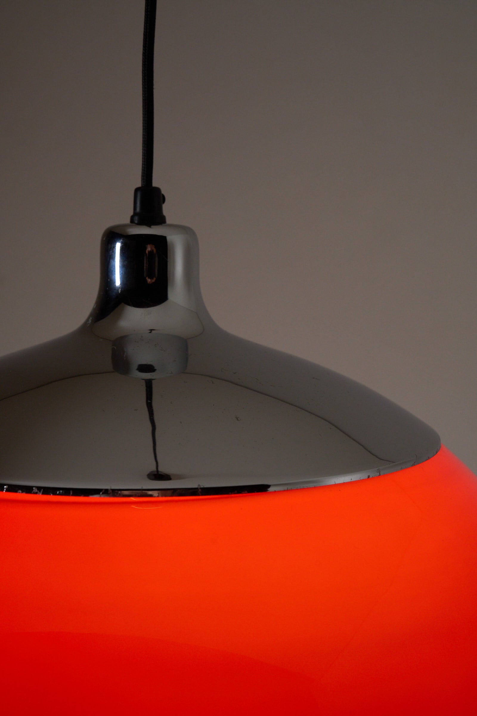 Cosack red acrylic ceiling lamp with chrome detail, Germany, 1970s close-up view highlighting chrome finish and bold red shade.
