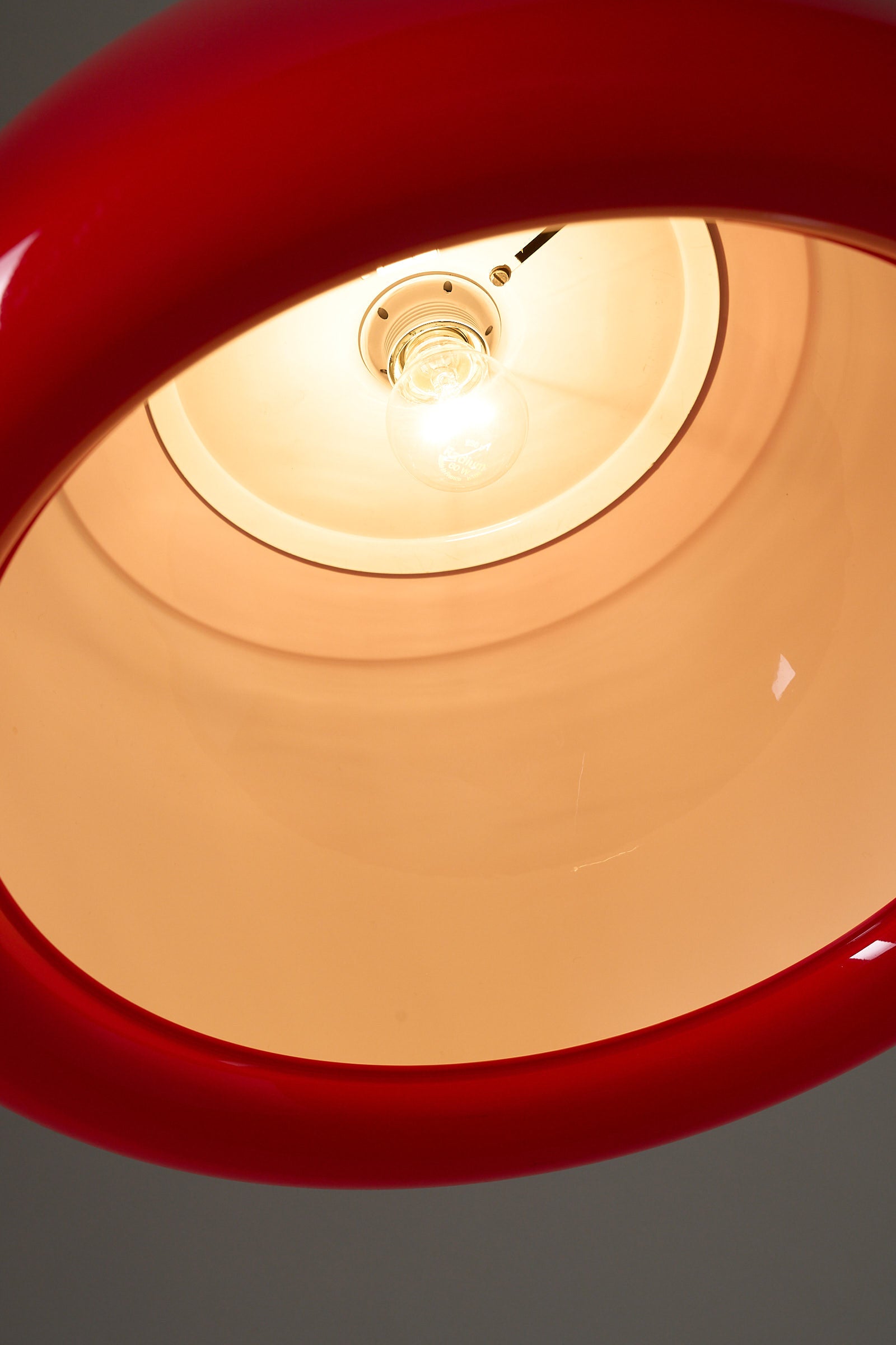 Cosack red acrylic ceiling lamp with chrome detail, Germany, 1970s highlighting the illuminated interior.