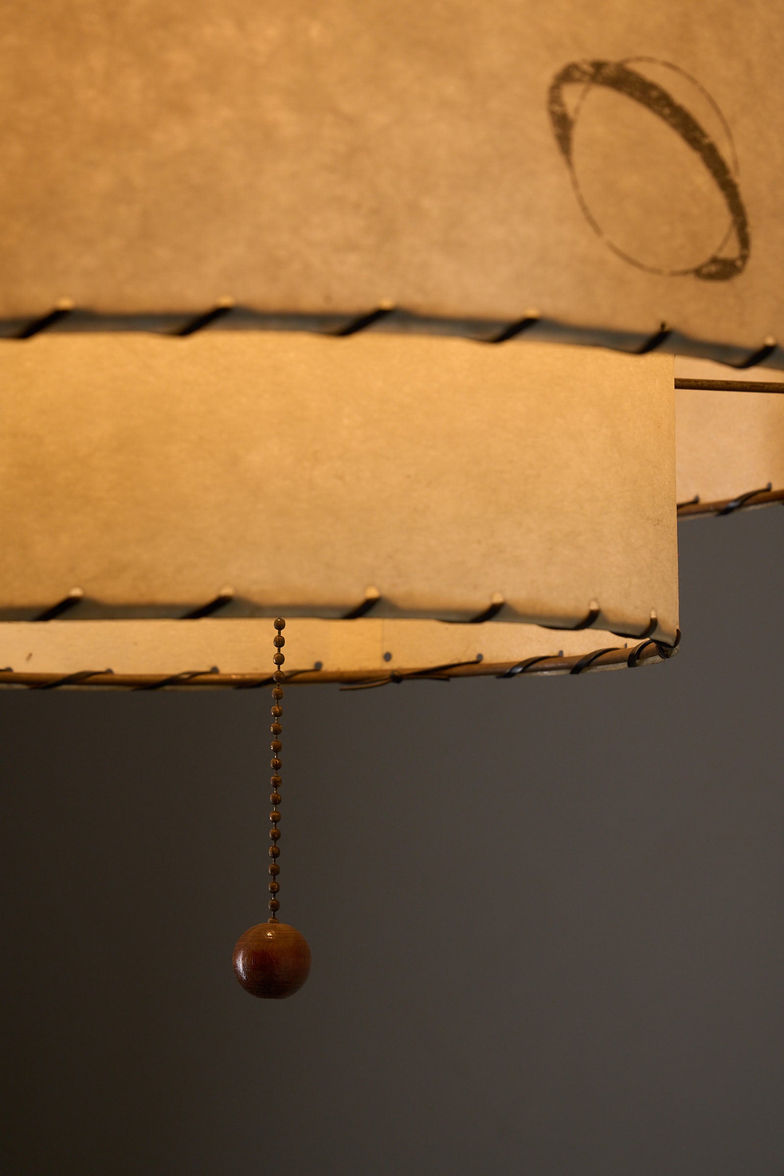 Parchment Pendant Lamp by Archaic Smile Inc featuring a double-tiered design and planet pattern.