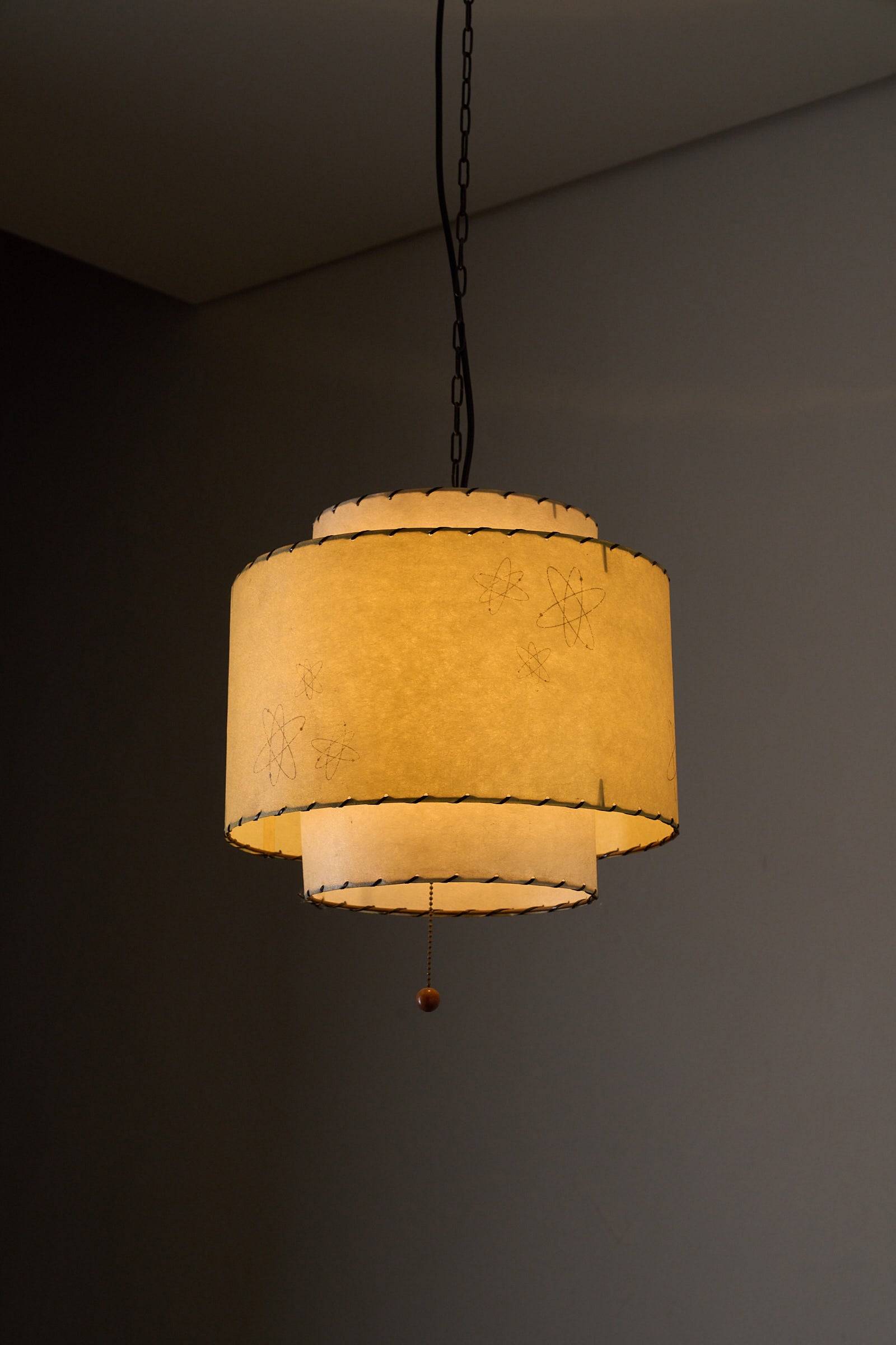 Atomic Pendant Lamp by Archaic Smile Inc, large double-tier parchment shade with atomic pattern.