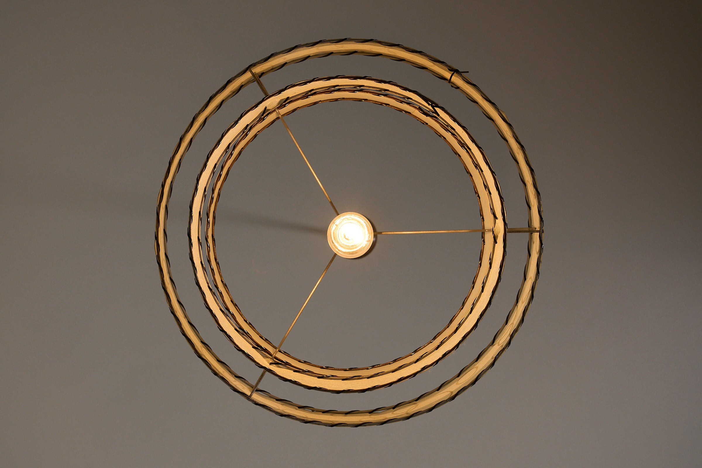 Bubble Motif Pendant Lamp by Archaic Smile Inc. featuring double-tiered parchment shade and circular pattern.