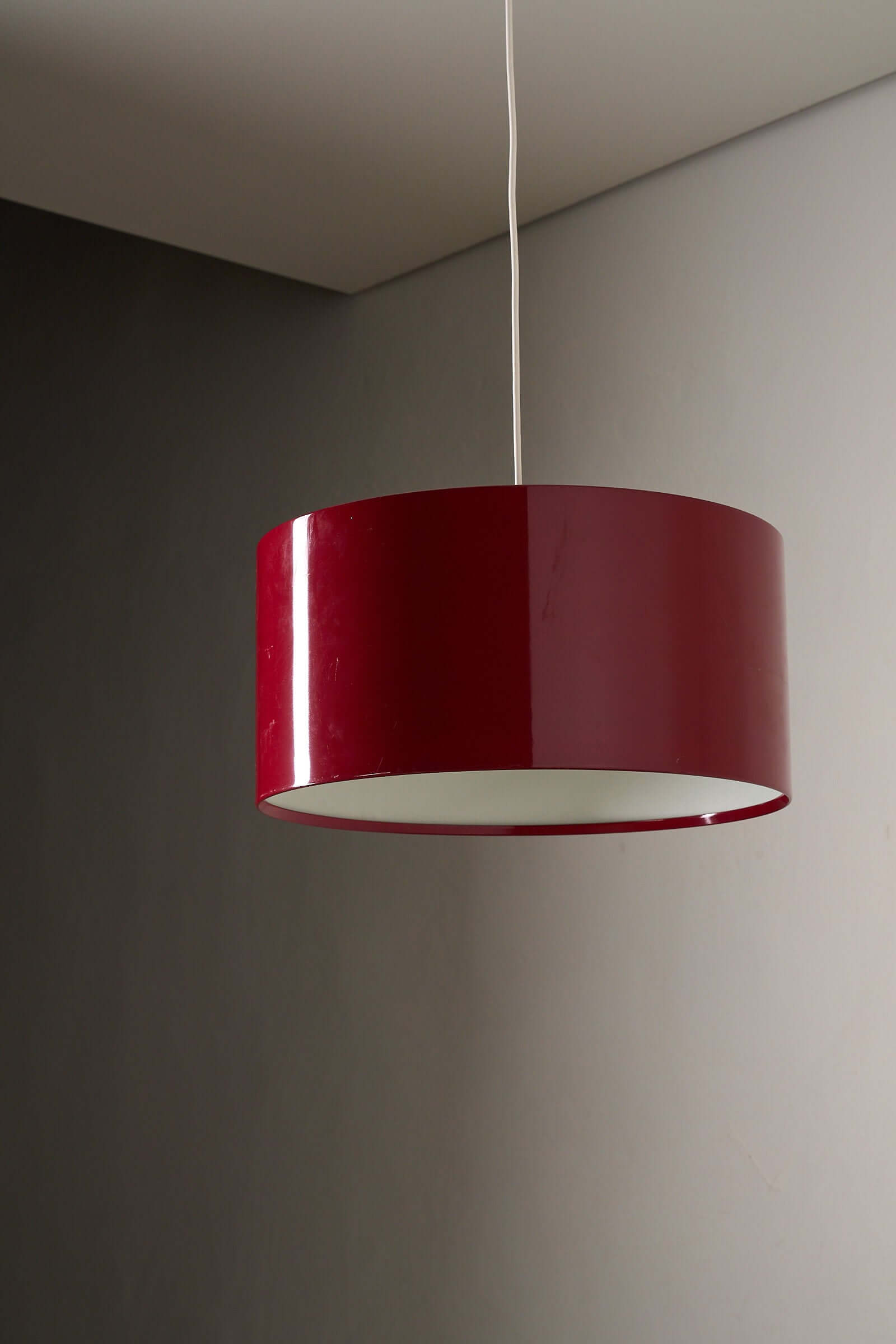 Fog & Mørup Drum Pendant in Bordeaux hanging ceiling lamp with sleek cylindrical design.