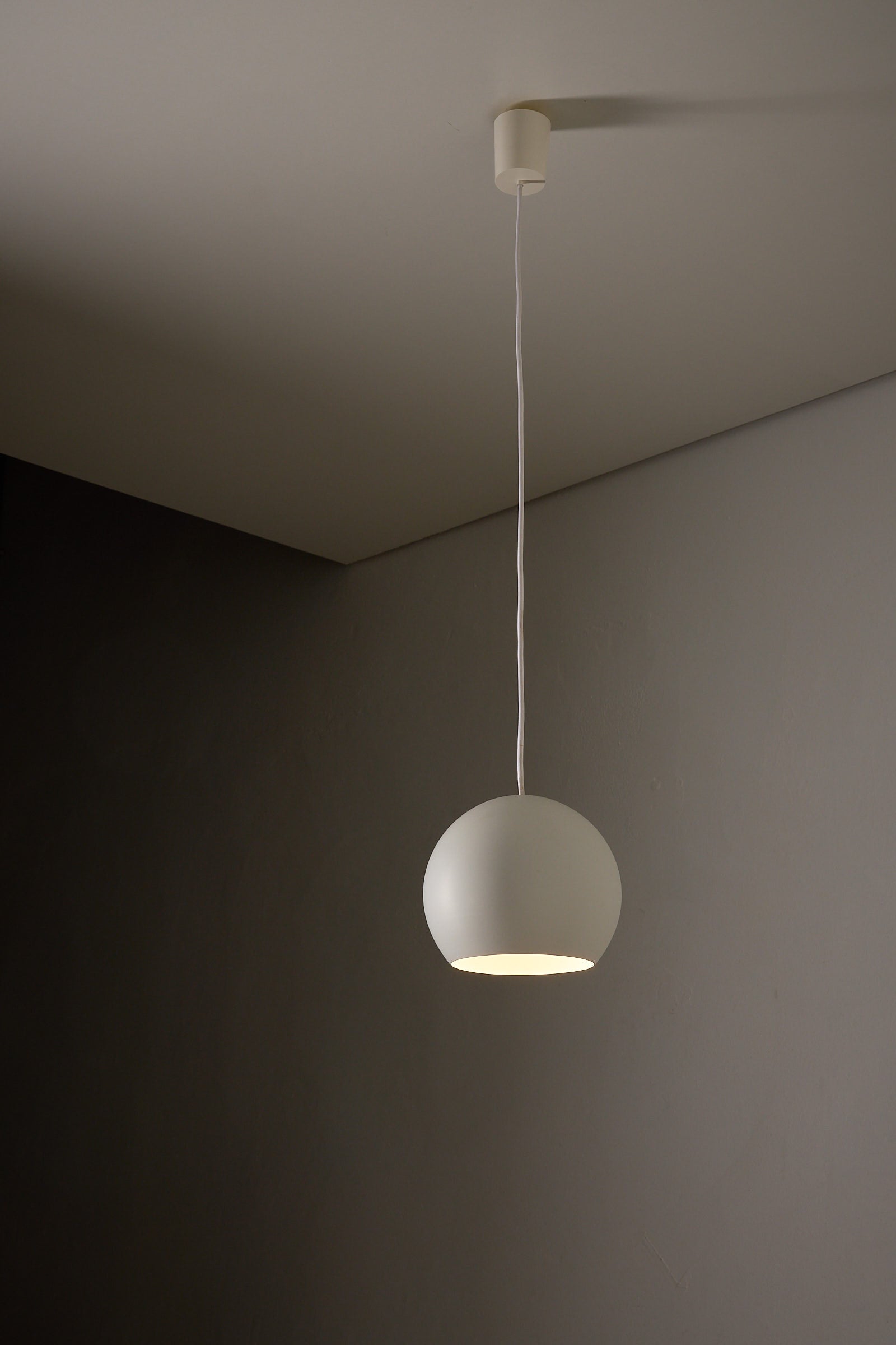 Light Grey Sphere Pendant  by Karl-Heinz Kinsky for Cosack hanging from the ceiling.