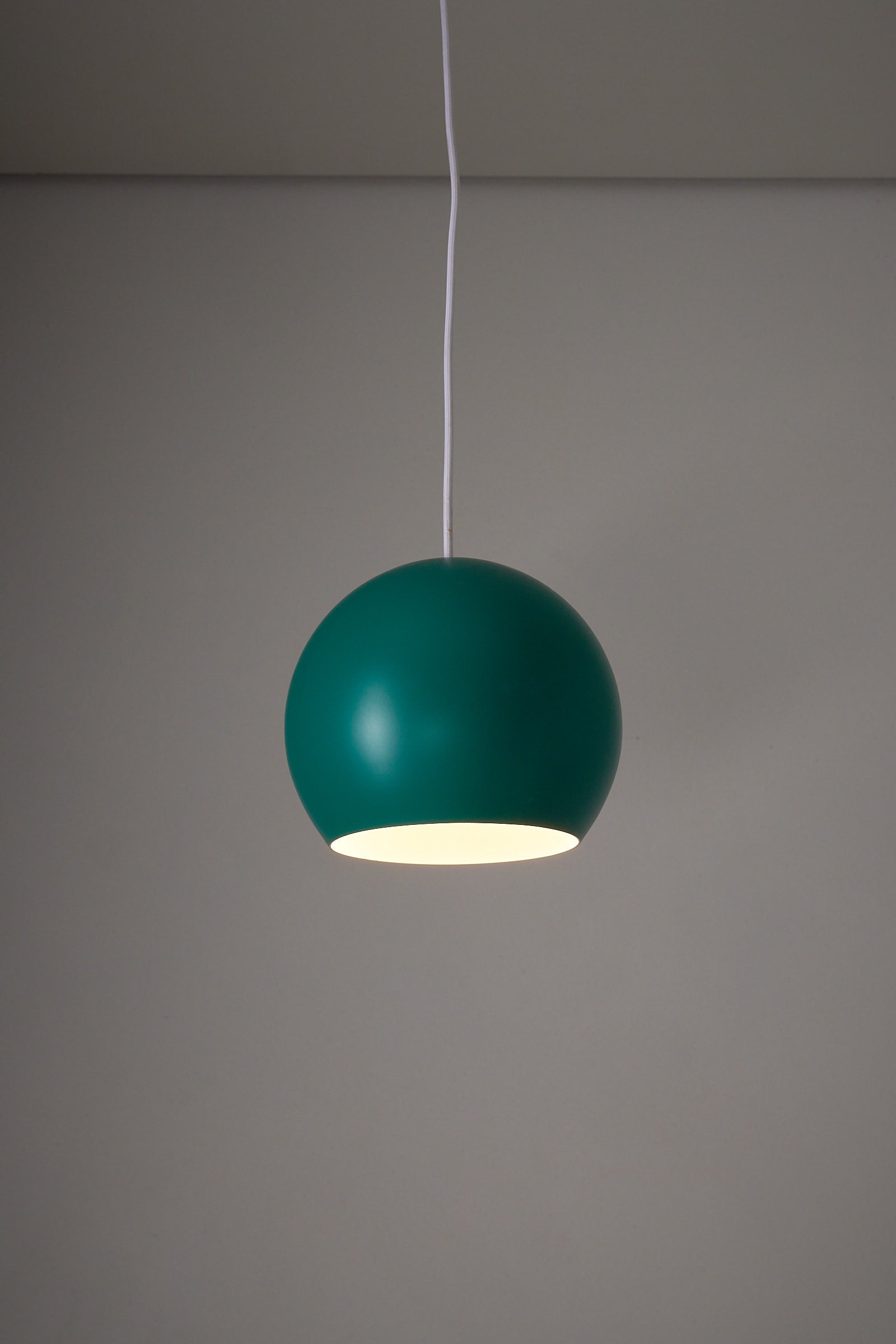 Turquoise Sphere Pendant by Karl-Heinz Kinsky for Cosack hanging in a minimalist setting.