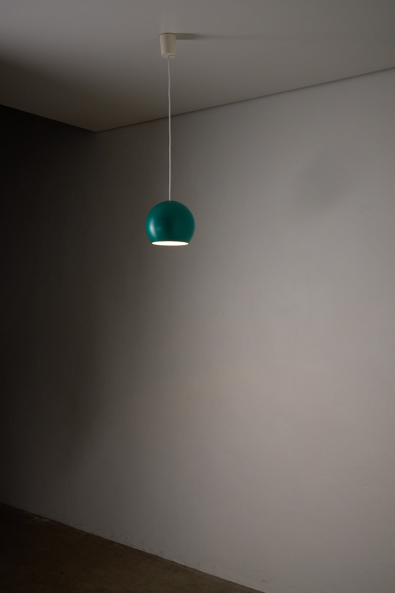 Turquoise Sphere Pendant by Karl-Heinz Kinsky for Cosack hanging in a minimalist interior.