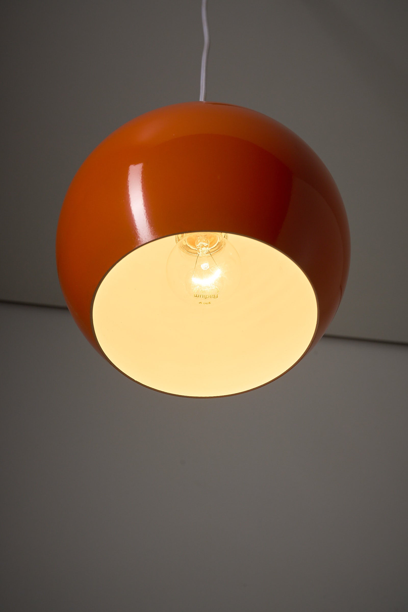 Orange Sphere Pendant by Karl-Heinz Kinsky for Cosack, a glossy orange ceiling lamp design.