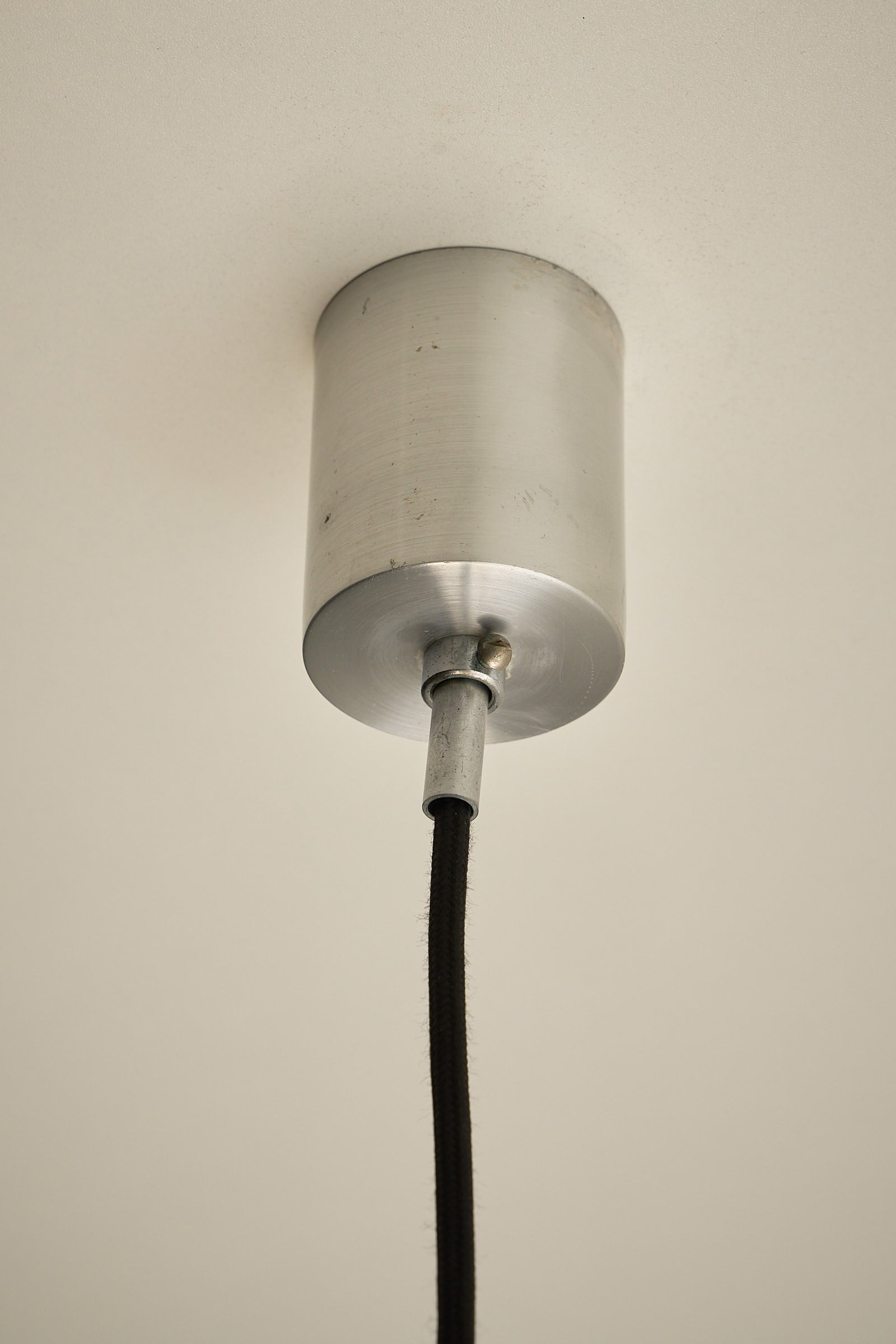 Brushed Aluminium Sphere Pendant ceiling light fixture with a minimalistic design.