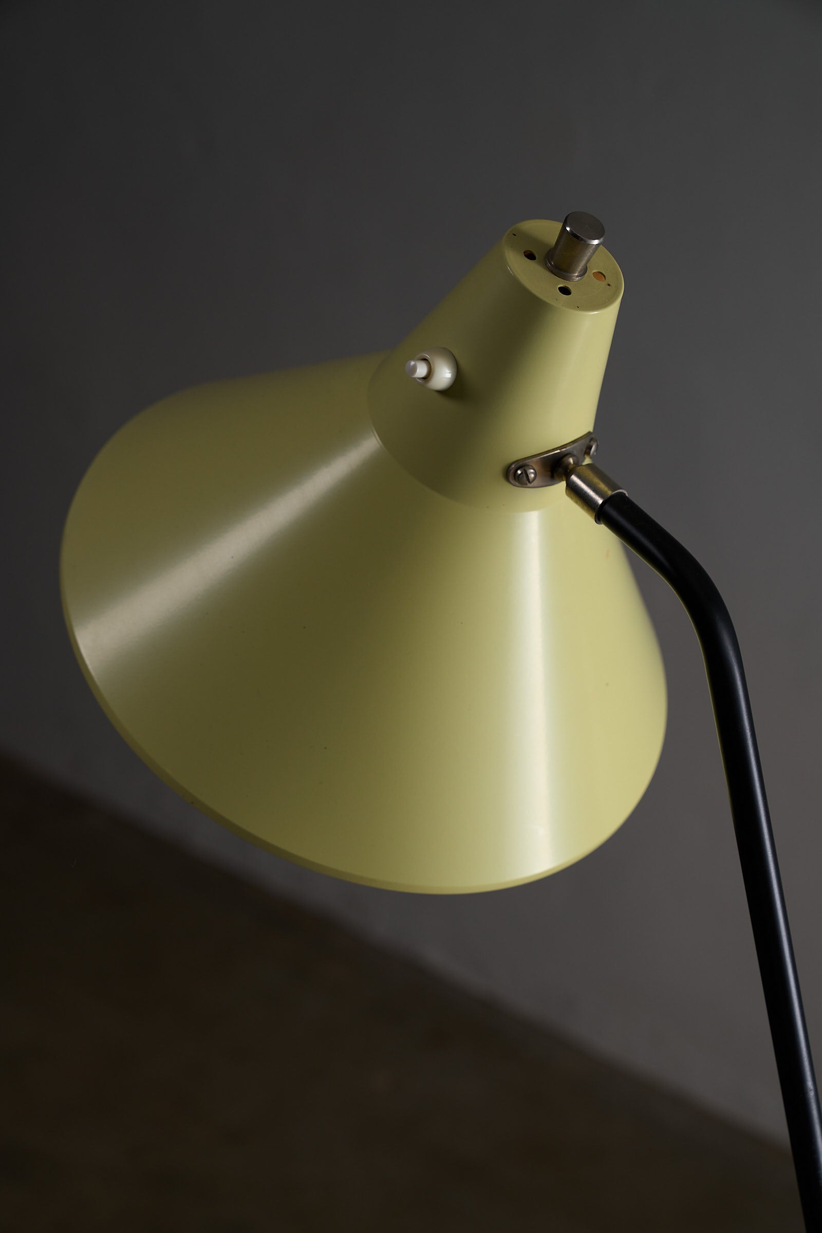 Grasshopper Tripod Floor Lamp by Willem van Doorn with a yellow conical shade and black arm detail.