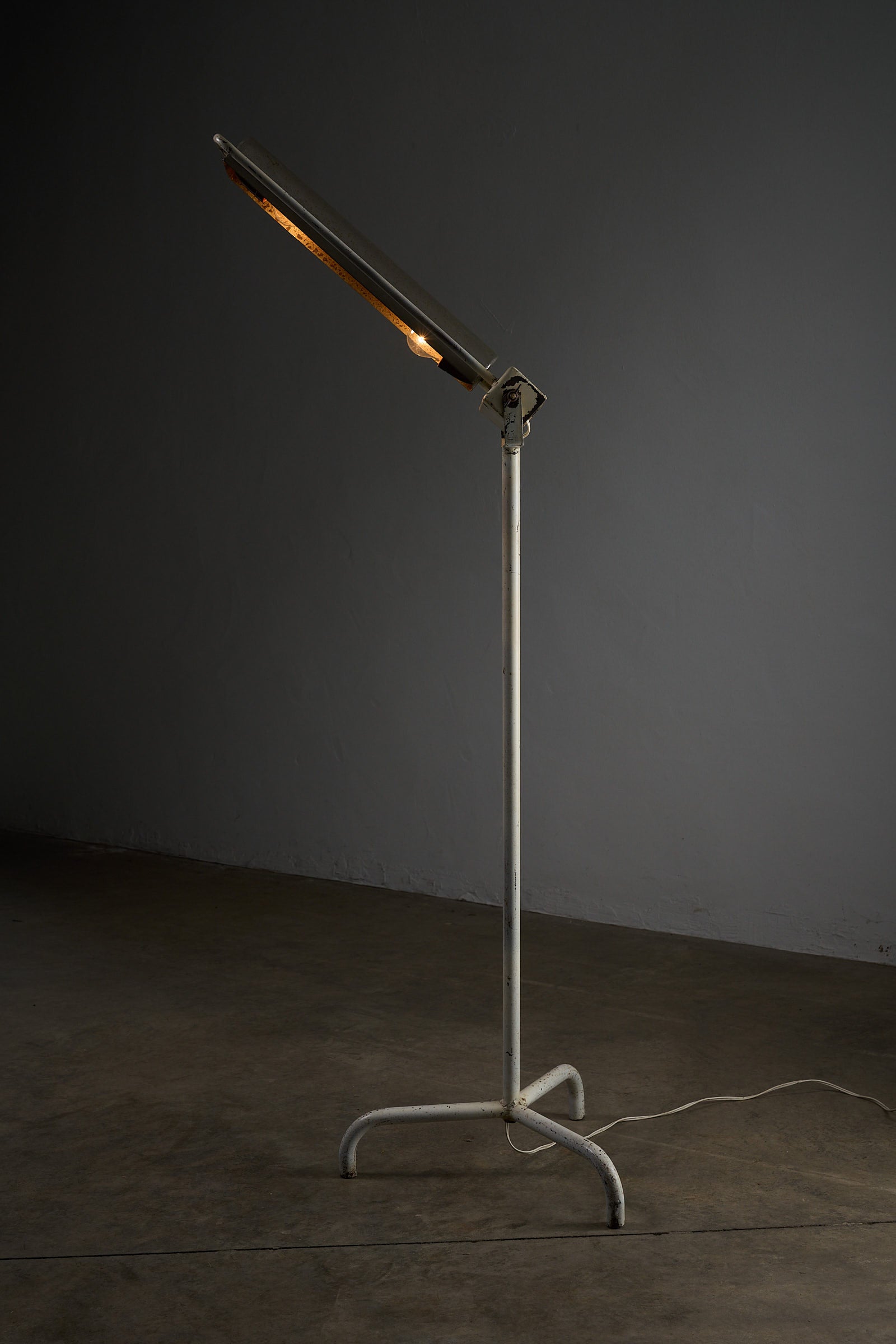 Industrial Medical Floor Lamp, Adjustable Enamel and Metal Construction with adjustable reflector in a sleek design.