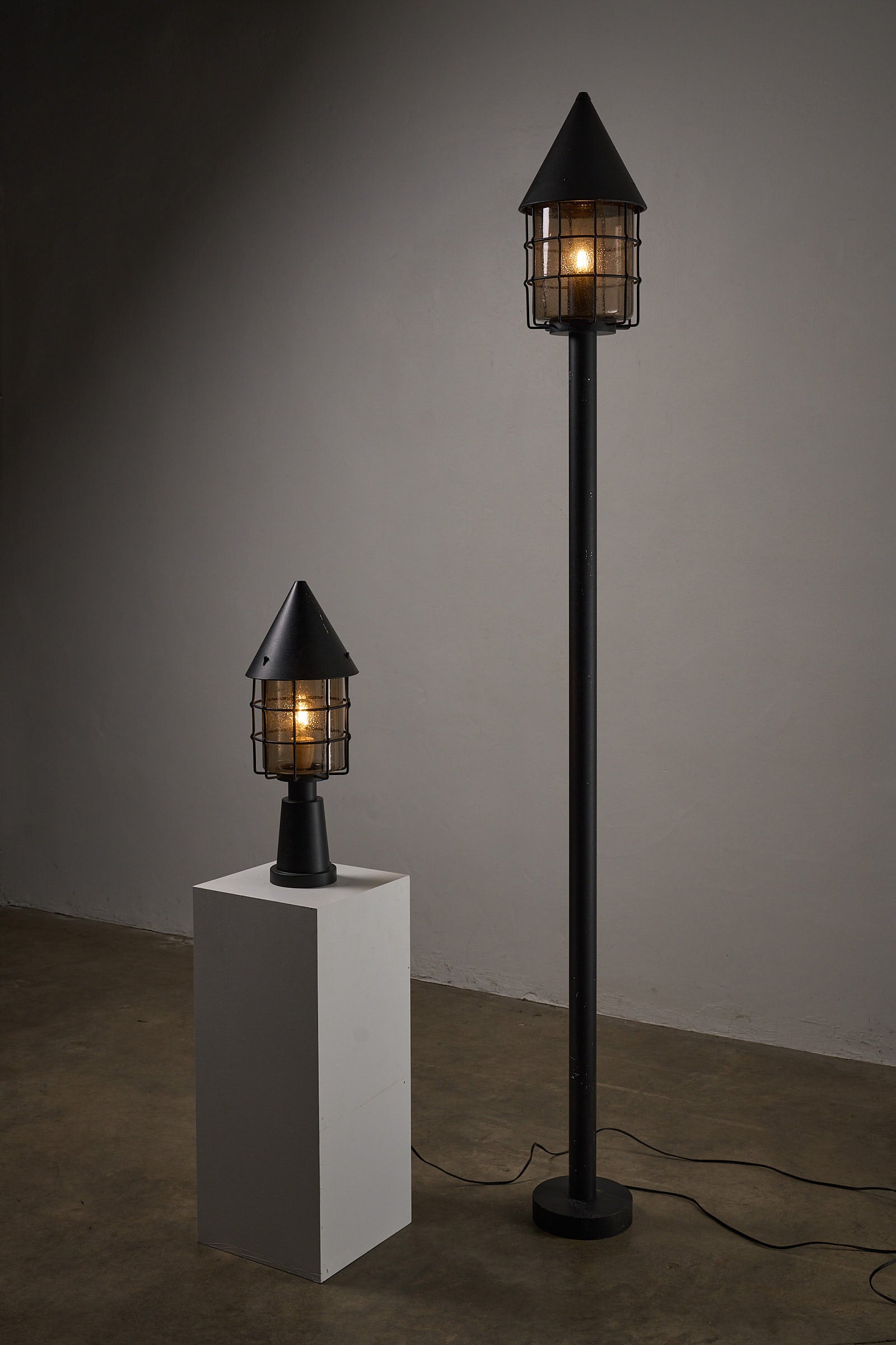 Outdoor Lantern by Boom BEGA showcased in a stylish minimalistic setting, highlighting its architectural design and elegance.