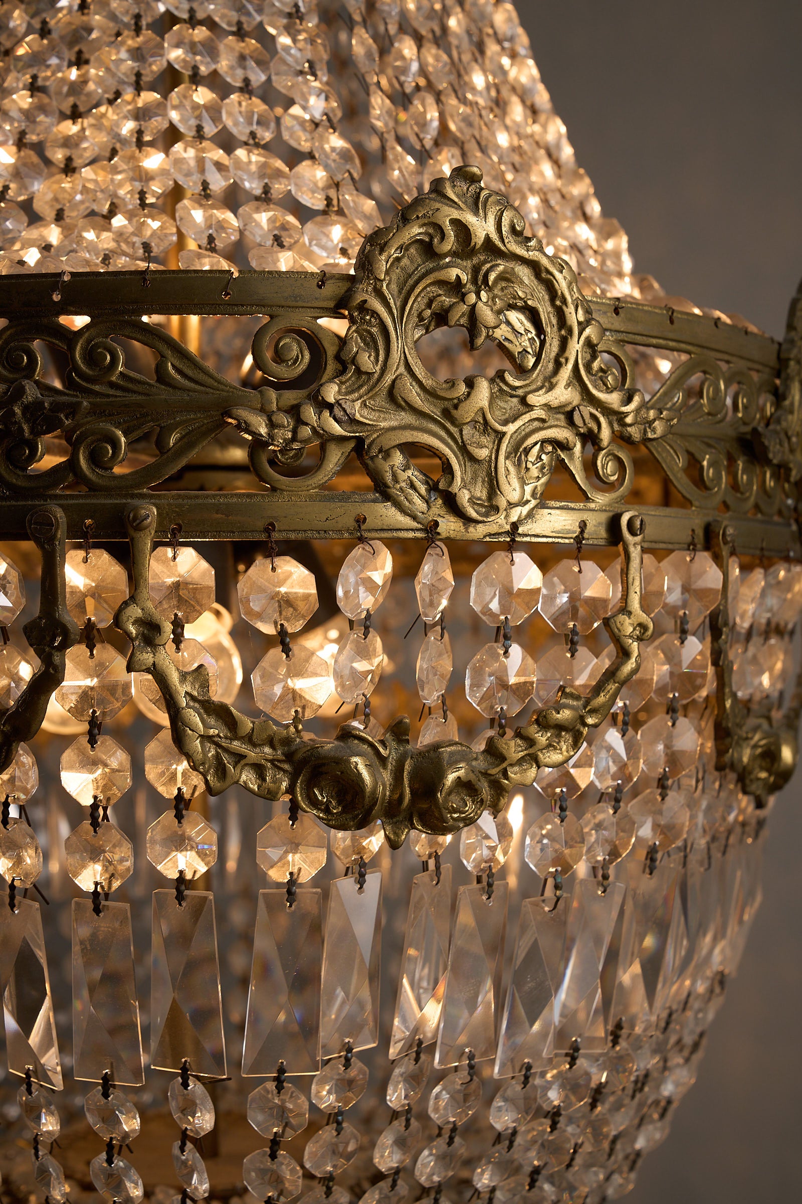 Close-up of Medium Empire-Style Brass and Crystal Chandelier with Garland Detailing, 20th Century, showcasing exquisite details.