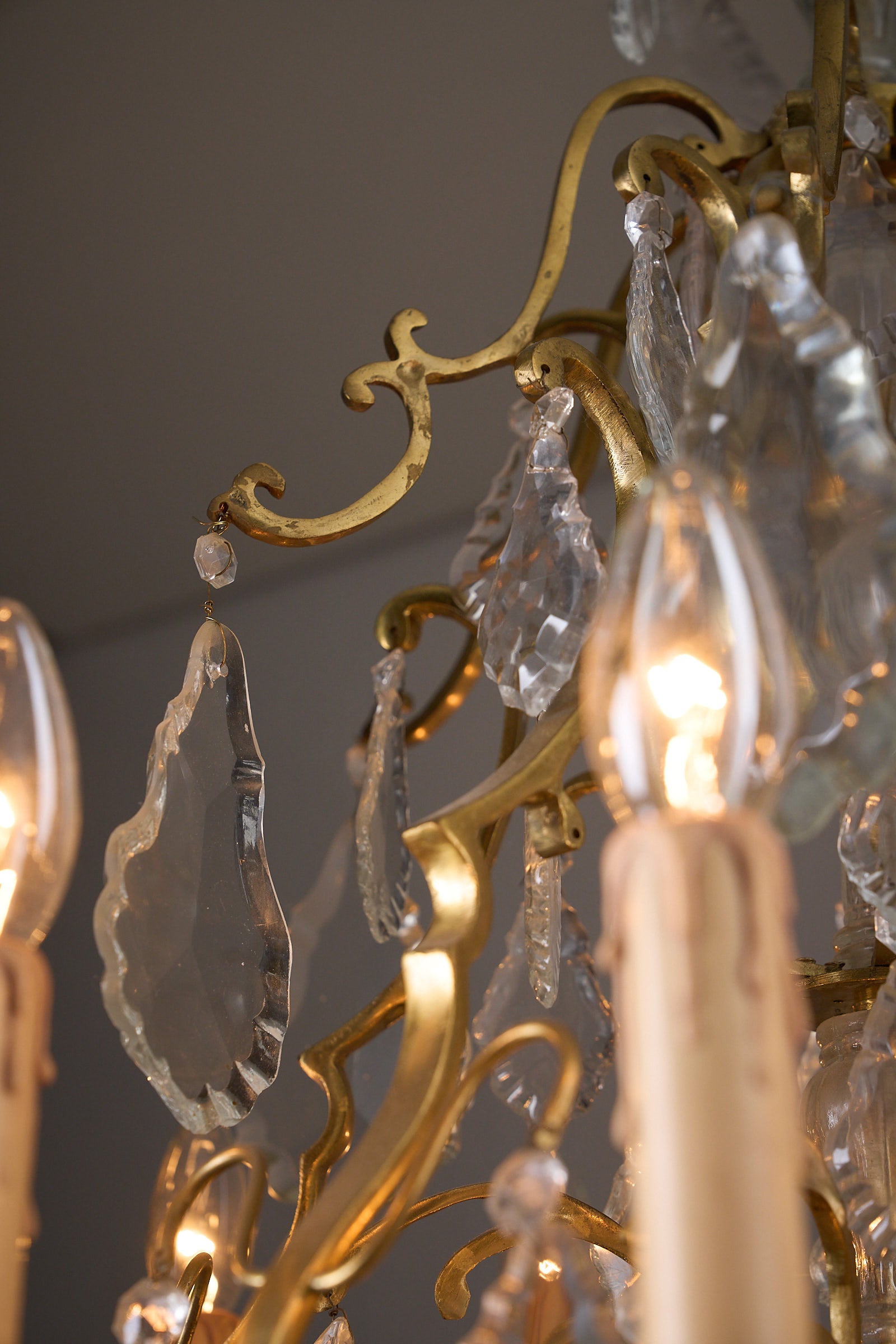 Empire-Style Chandelier in Brass and Crystal showcasing ornate brass and crystal pendant details.