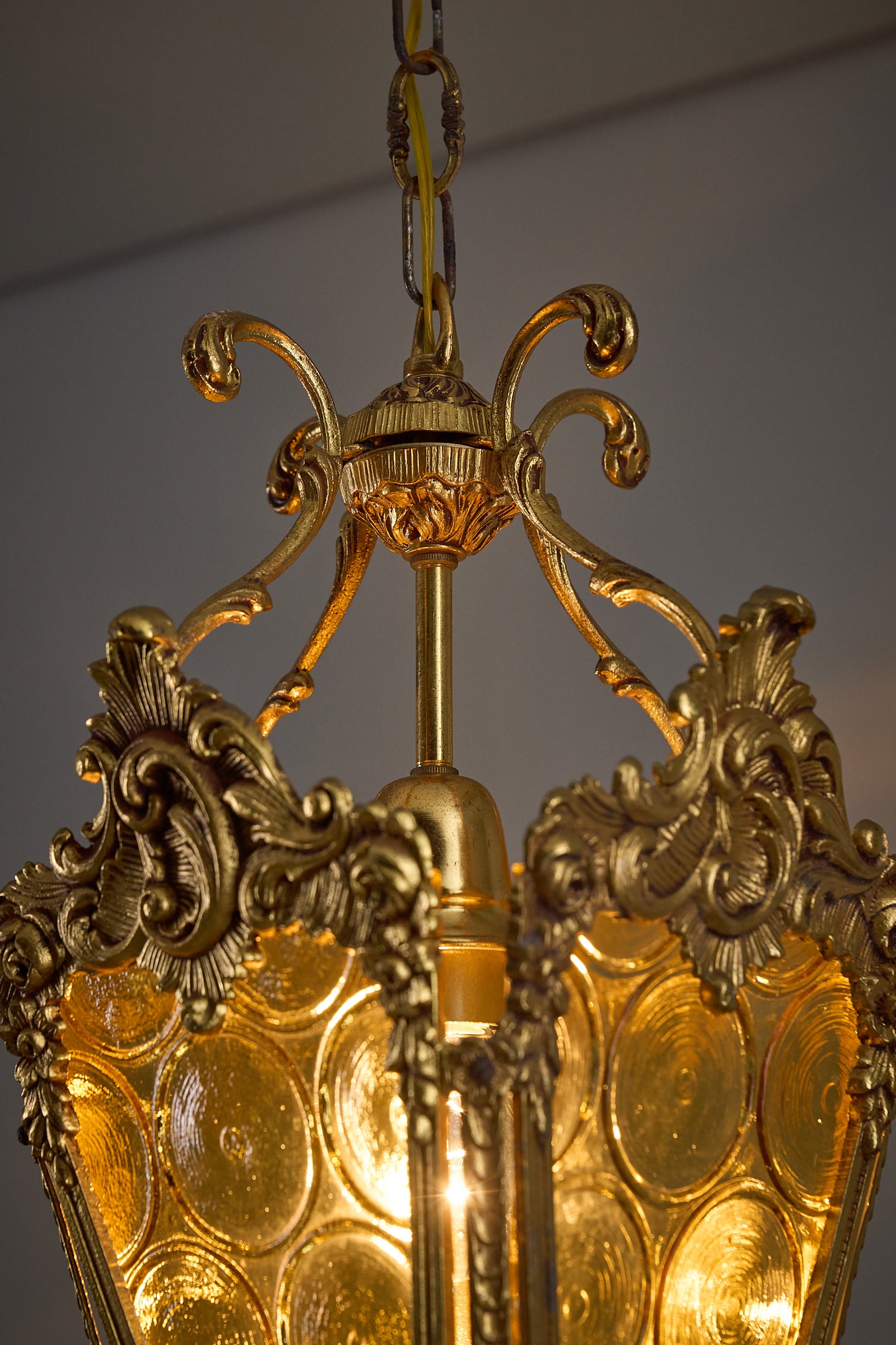 Rococo-Style Gilt Pendant Lamp with Structured Amber Glass showcasing ornate metal frame and amber glass panels.