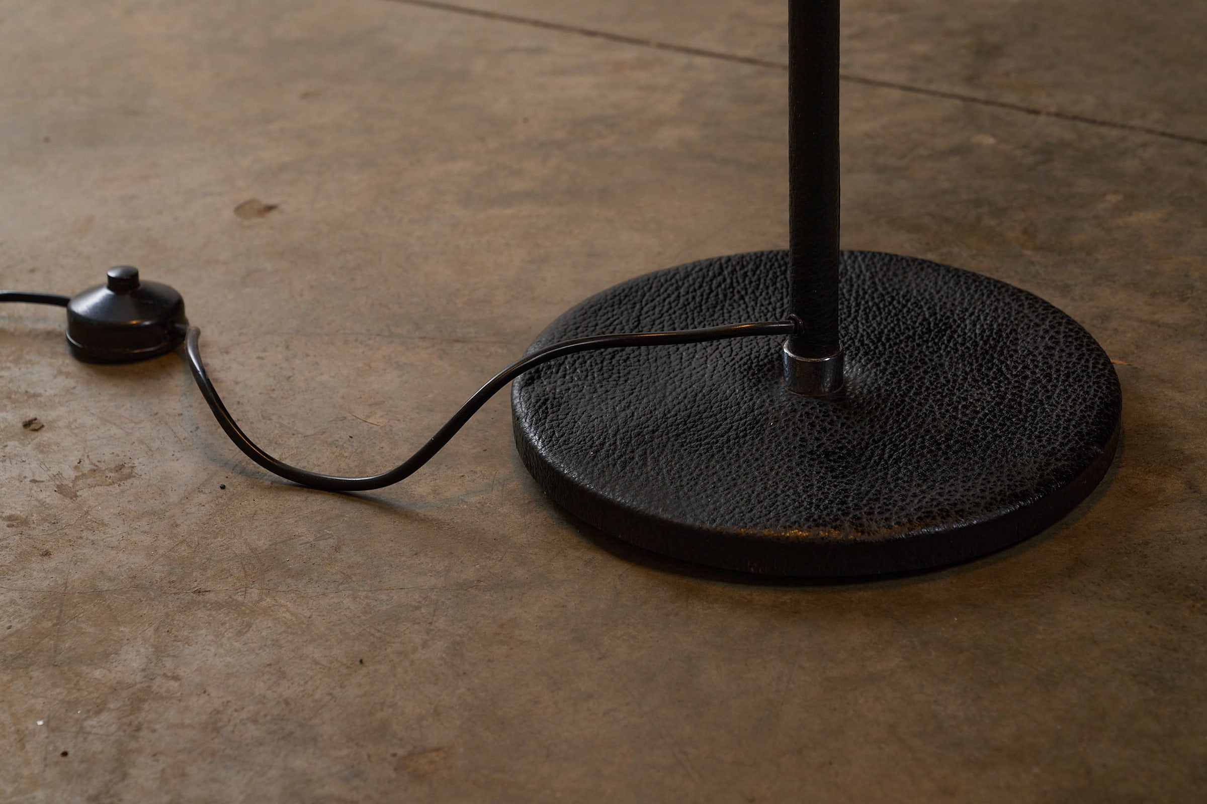 Floor Lamp by Staff Leuchten with Bordeaux Shade and Leather Base detail of black leather base and power cord.