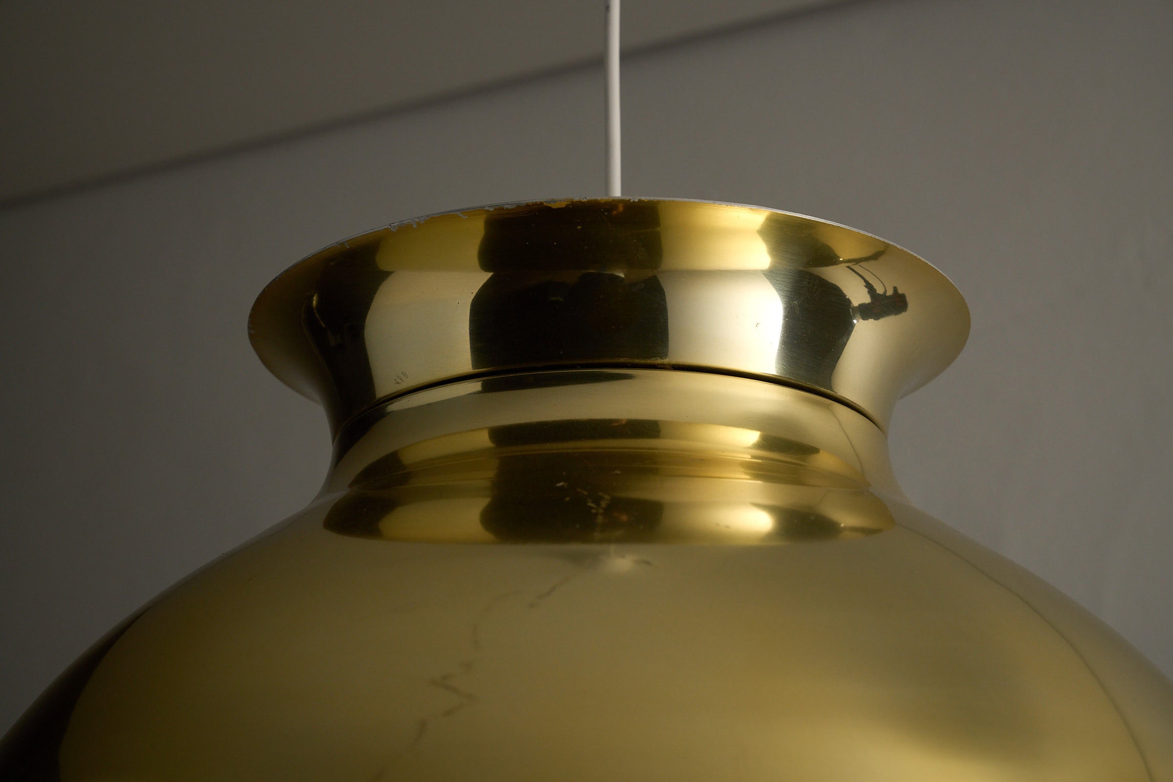 Large Brass Dome Pendant showing polished brass shade detail and white cable.