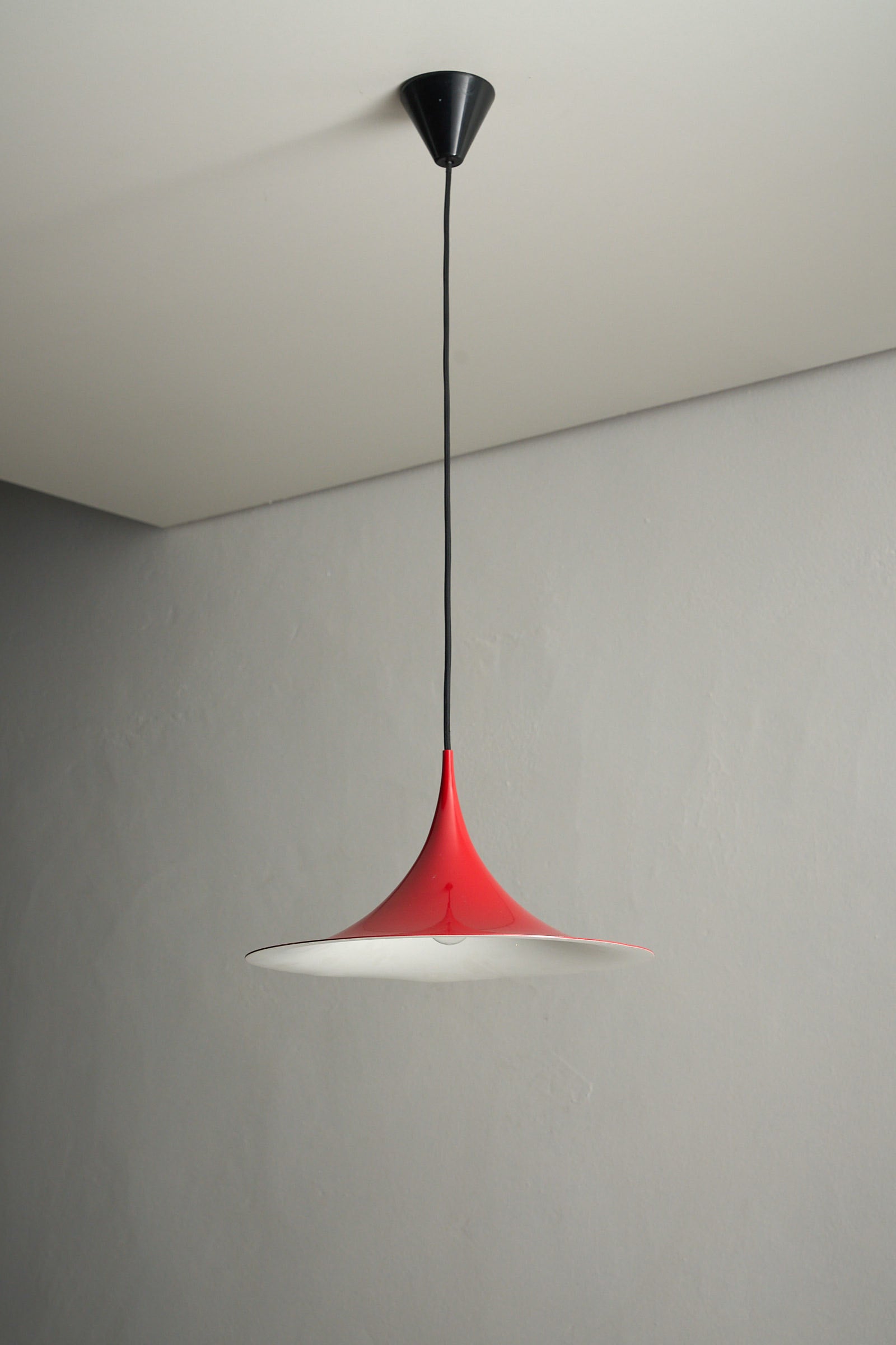 Fog&Mørup Red Semi Pendant Lamp featuring a refined red enamel shade and woven cord, designed by Claus Bonderup and Torsten Thorup.