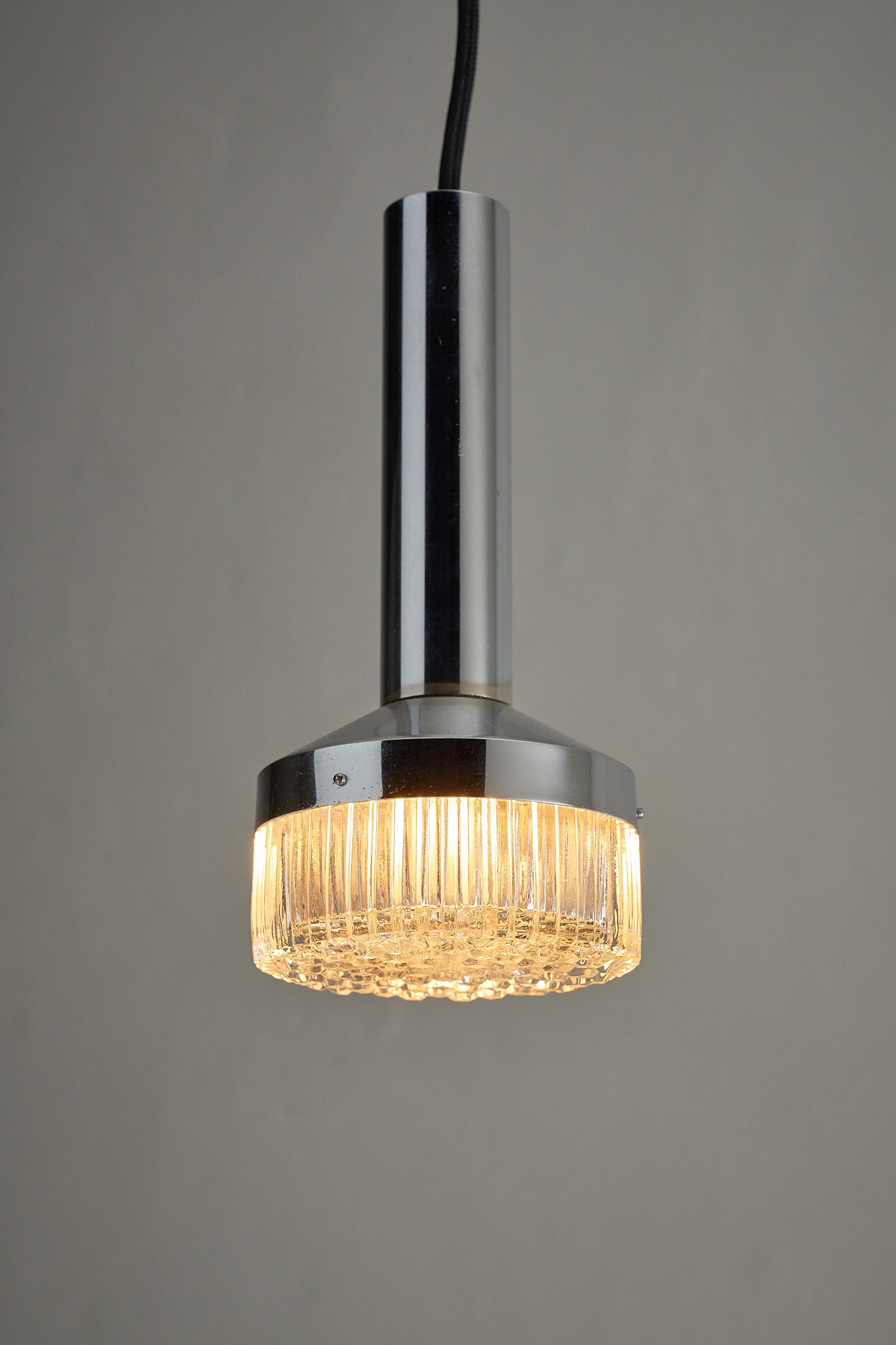 Chrome Pendant Lamp With Textured Glass Diffuser showcasing a sleek chrome finish and unique glass design.