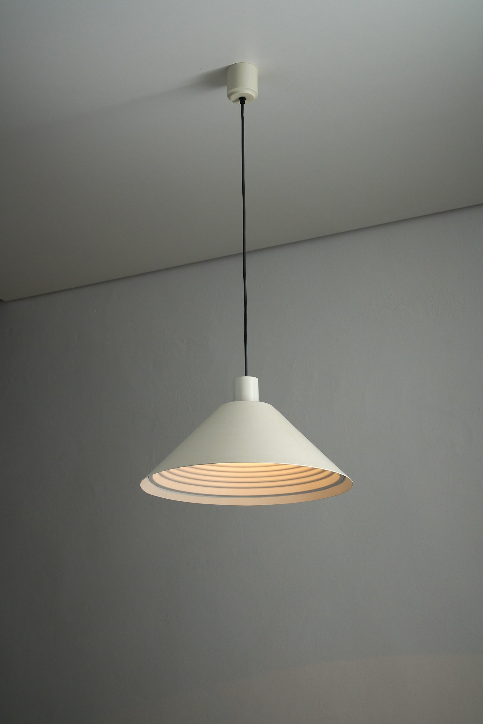 Martinelli Luce Model 1836 Conical Pendant Lamp with smooth and ribbed white metal shades.