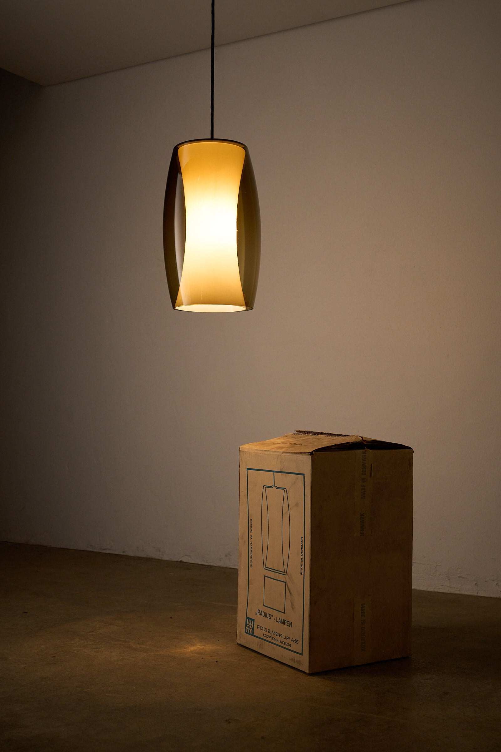 Jo Hammerborg 'Radius' Pendant Lamp for Fog&Mørup hanging above a box, showcasing mid-century Danish design.