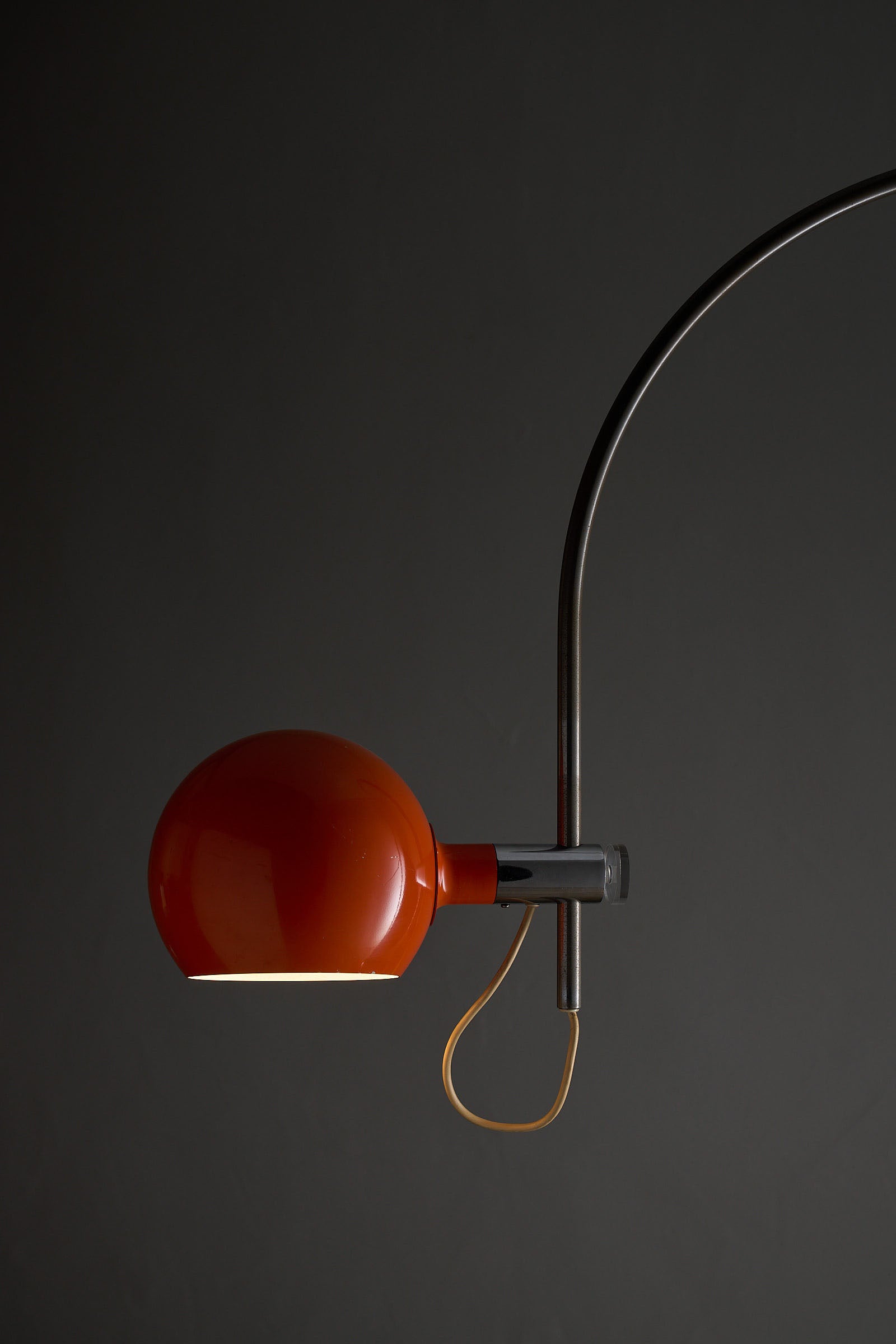 Orange Arc Floor Lamp by Cosack with vibrant orange spherical shade and arching metal stem