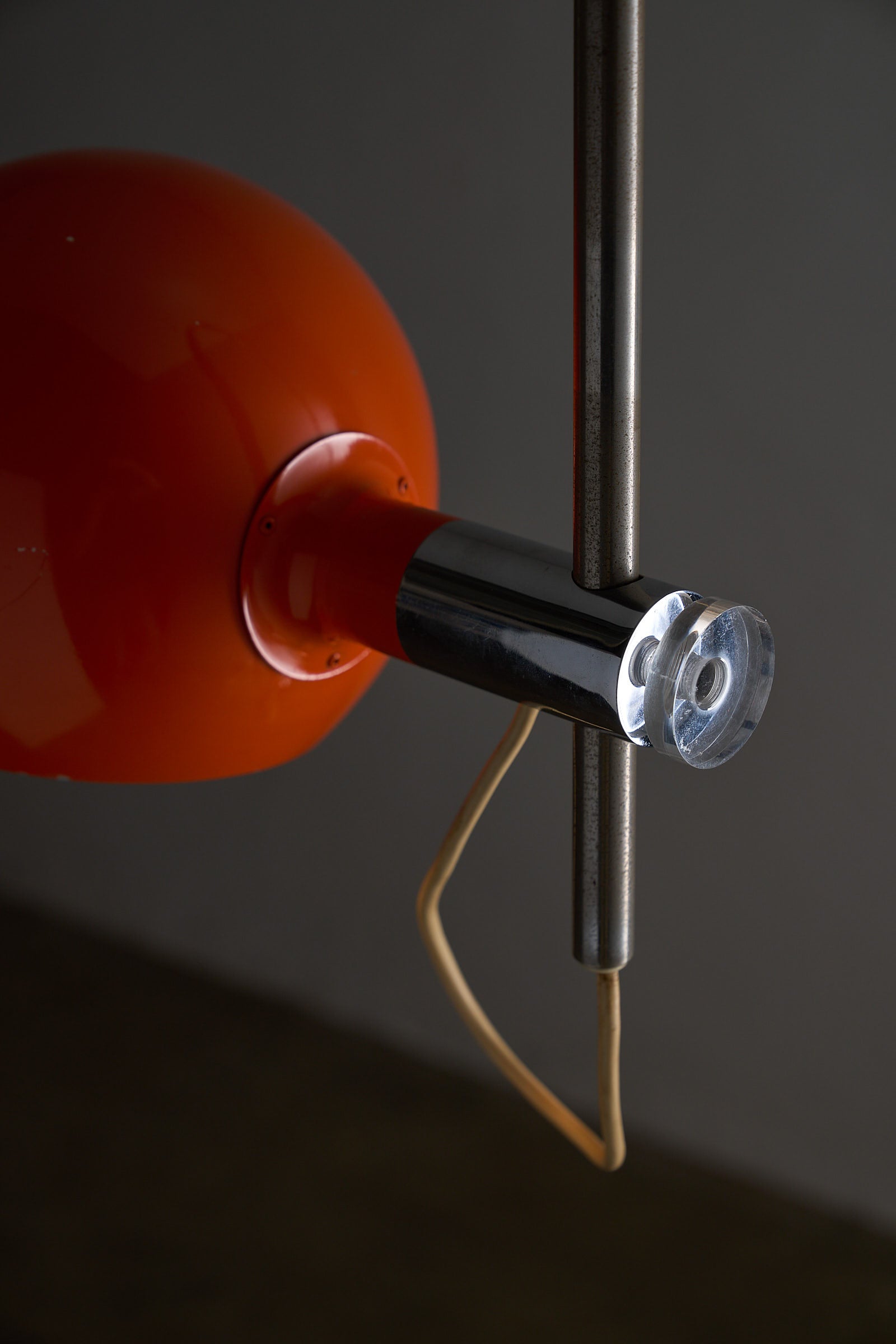 Orange Arc Floor Lamp by Cosack close-up of the vibrant orange shade and chrome fixture.