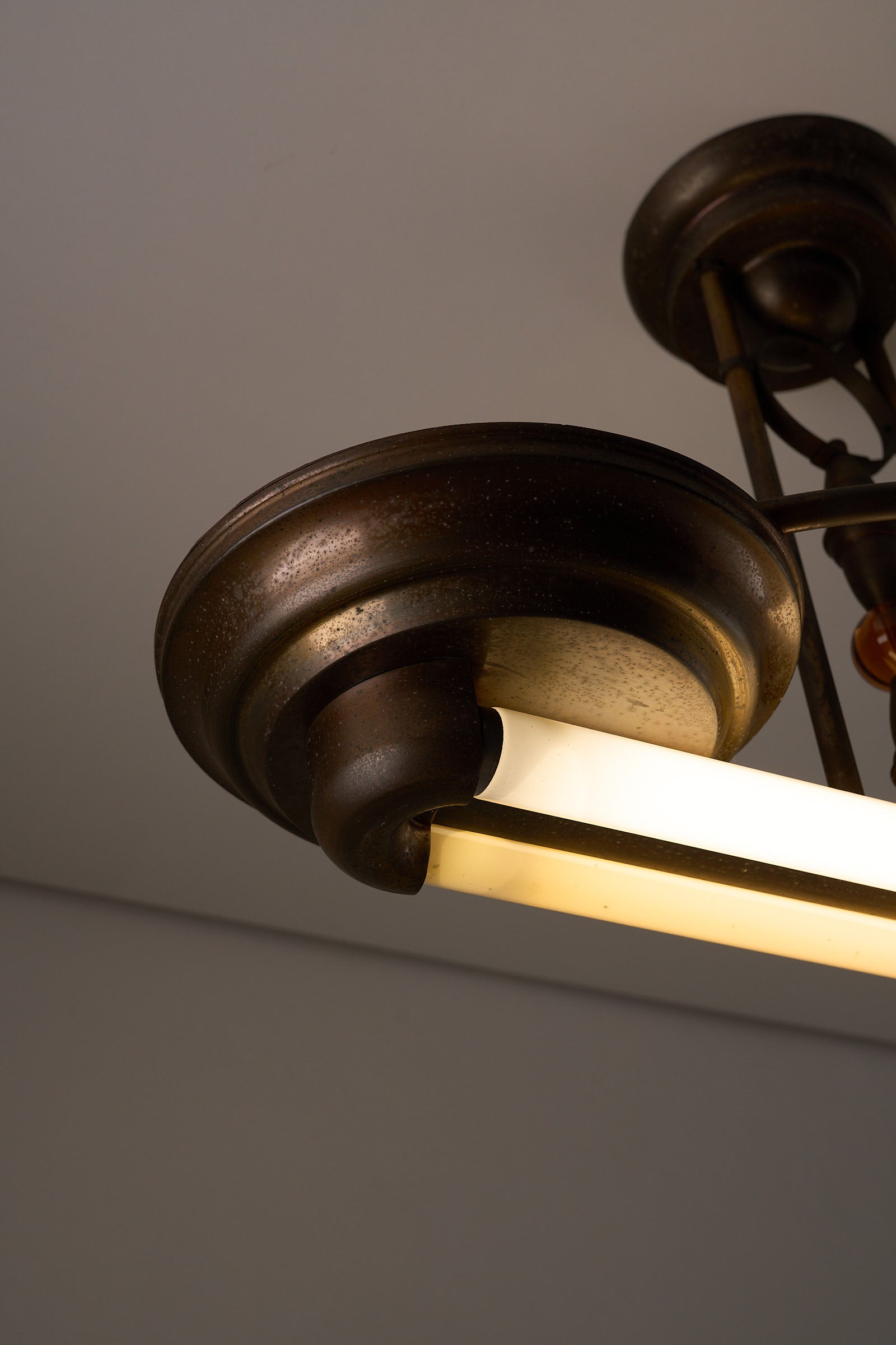 Antique Art Deco Double Fluorescent Ceiling Fixture in Patinated Bronze showcasing the bronze finish and fluorescent light.