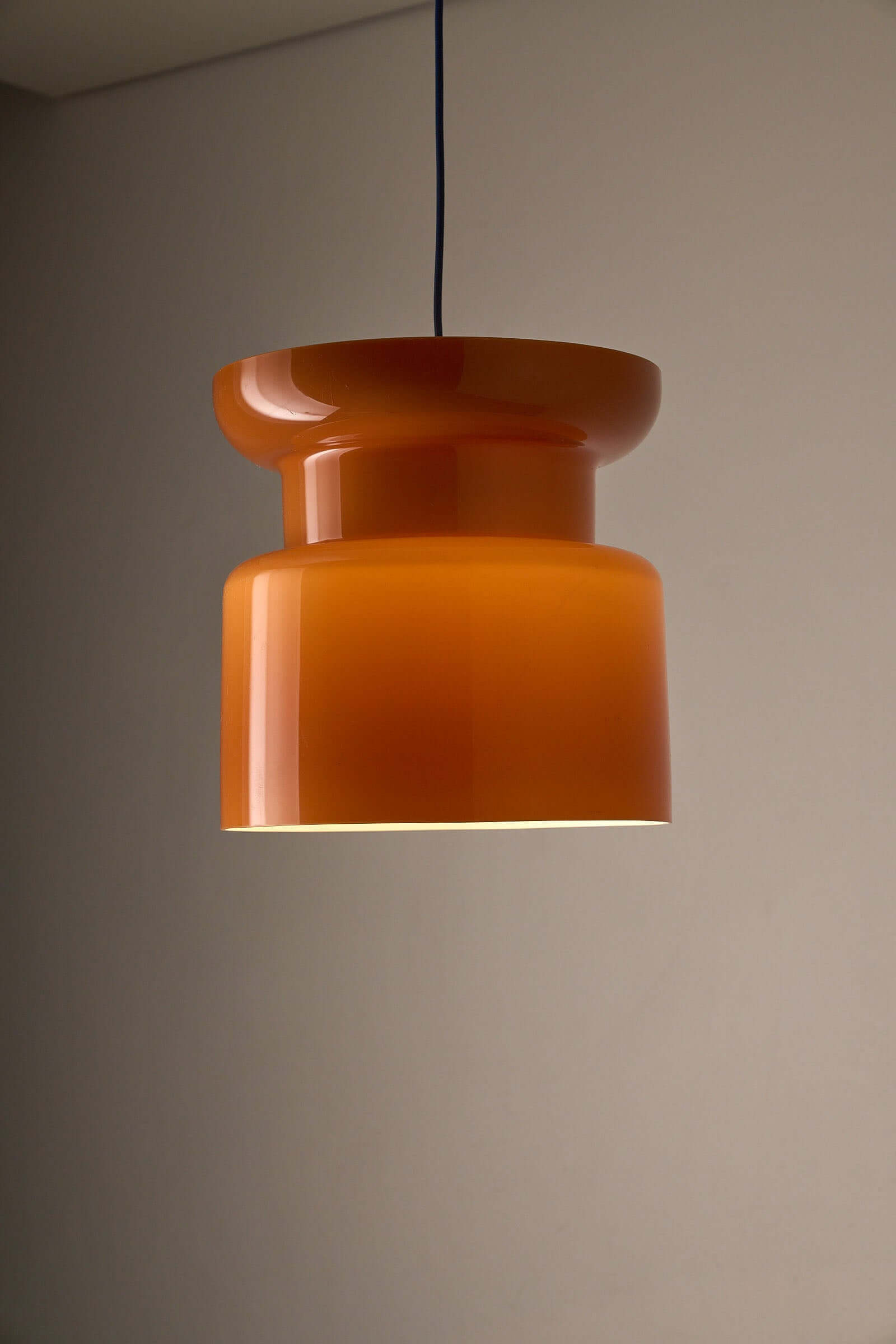 Translucent Orange Pendant with Dual Light Sources hanging lamp showcasing hourglass form and translucent glass.
