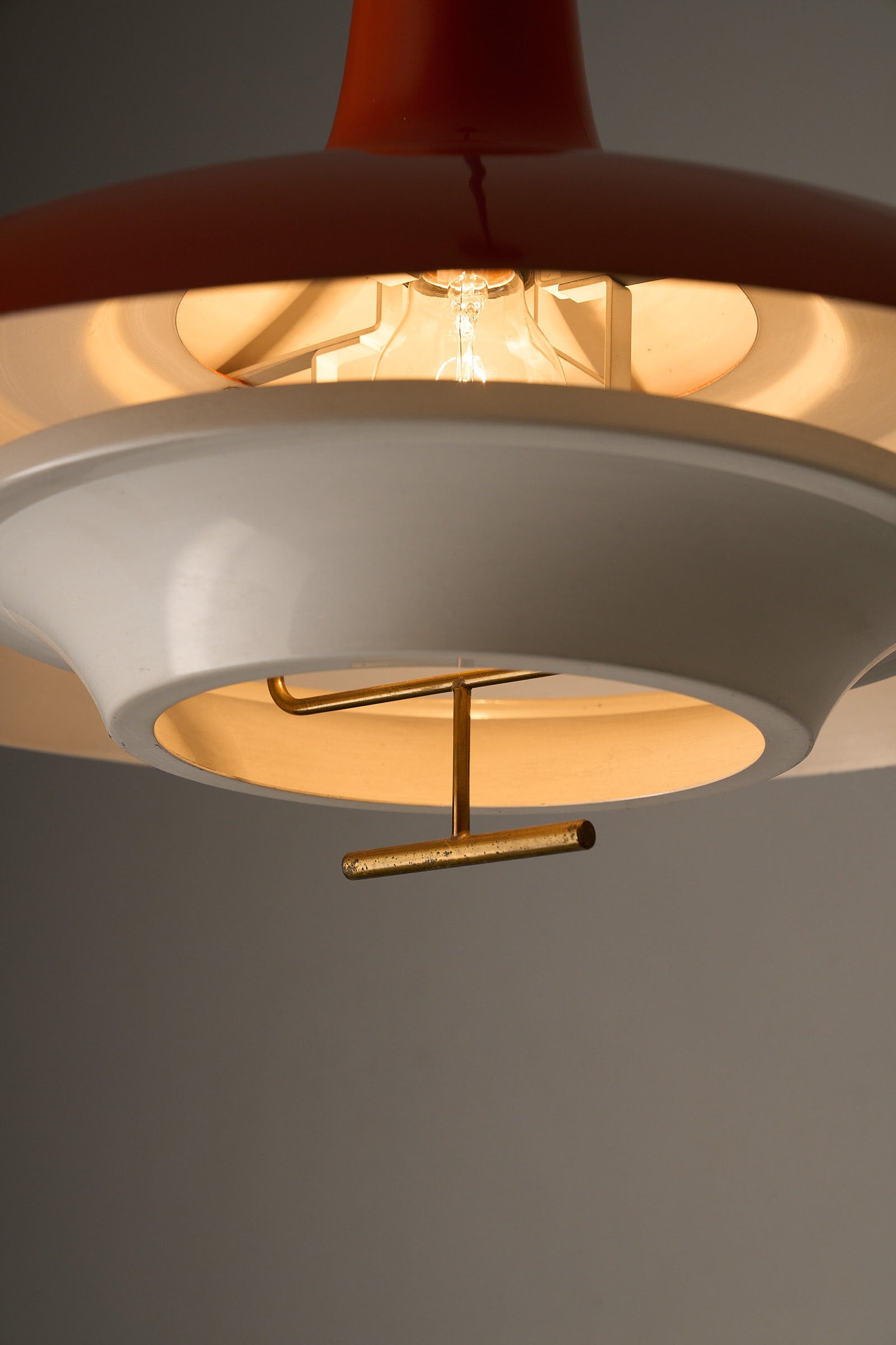 1960s Orange Pendant with Brass Detail showcasing the multi-shade design and soft light distribution.