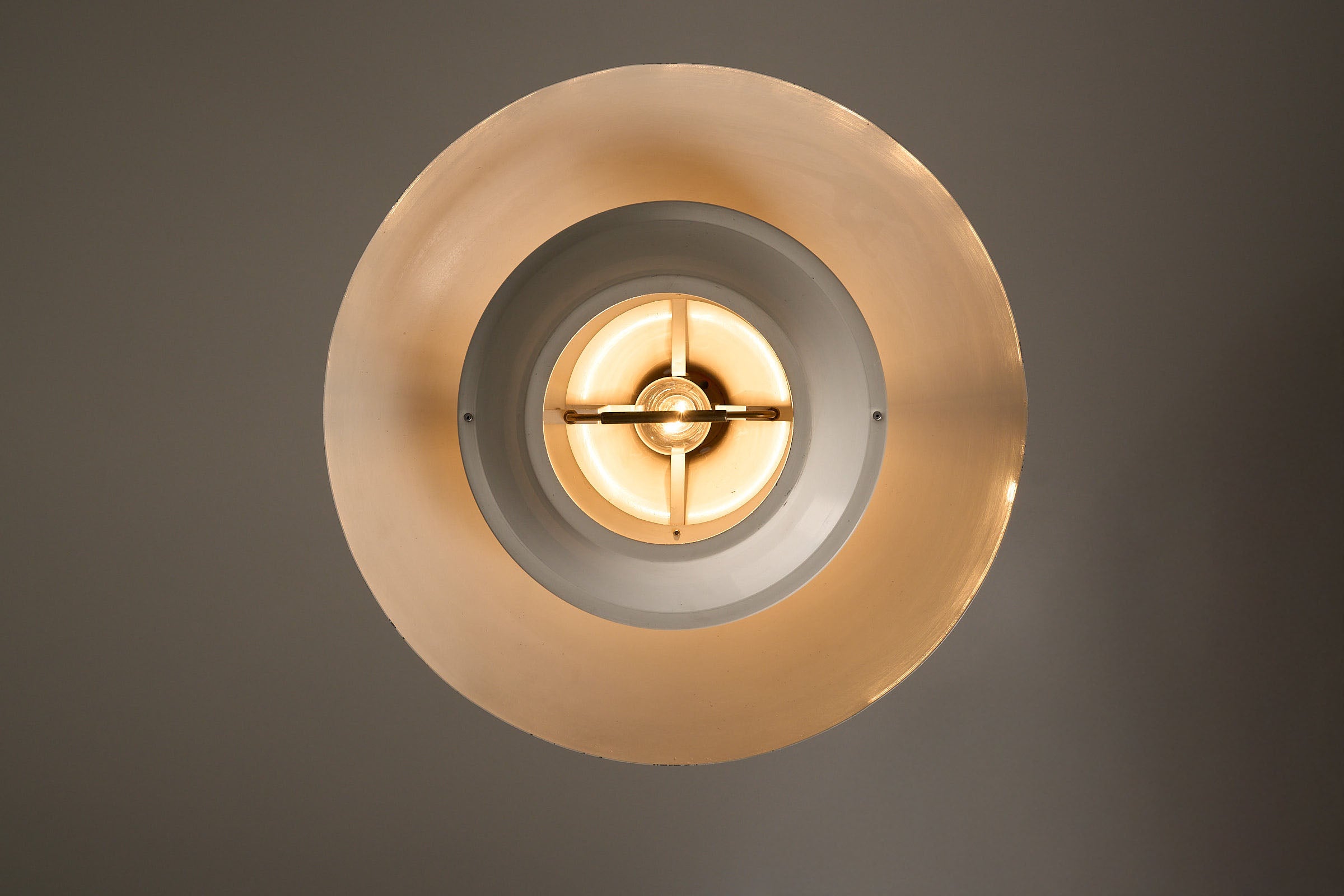 1960s Orange Pendant with Brass Detail, showcasing layered design and concealed light source.