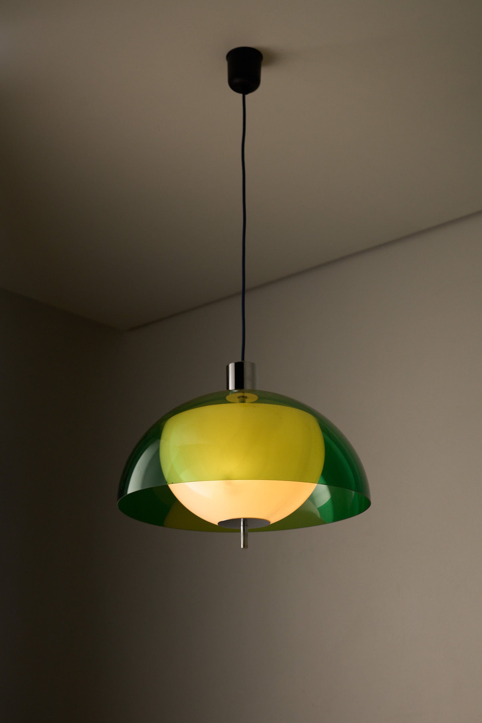 Space Age Layered Plexiglass Pendant in Green and White hanging lamp with green and white shades.