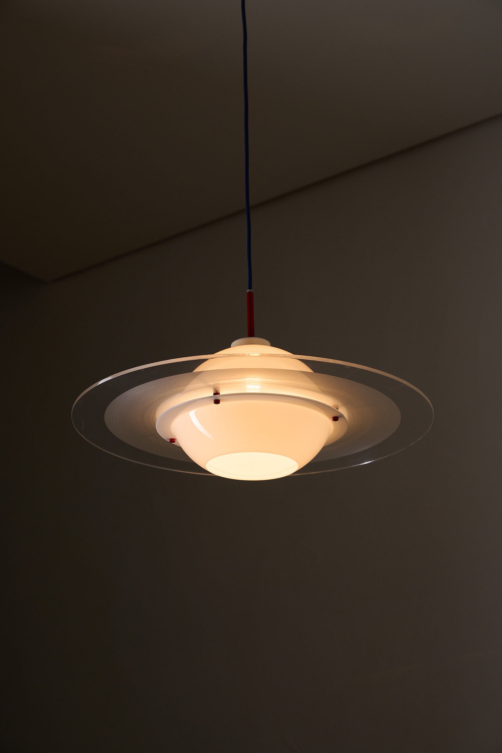 Space Age 'Saturn' Plexiglass Pendant Lamp with Red Details hanging in a modern interior setting.